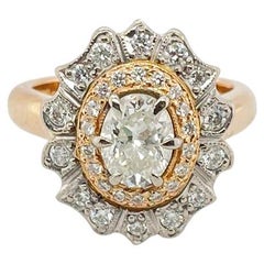 Oval cut diamond halo ring in 18ct rose and white gold GIA certified 