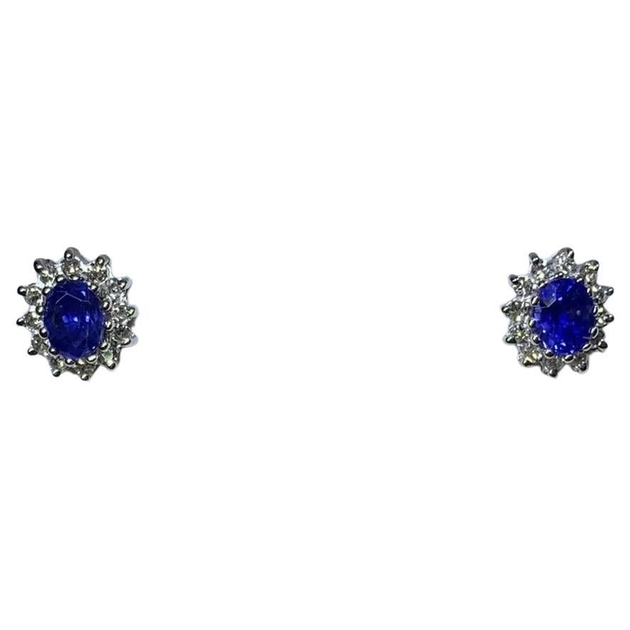 0.90ct Oval sapphire and diamond halo stud earrings in 18k whitw gold matching.