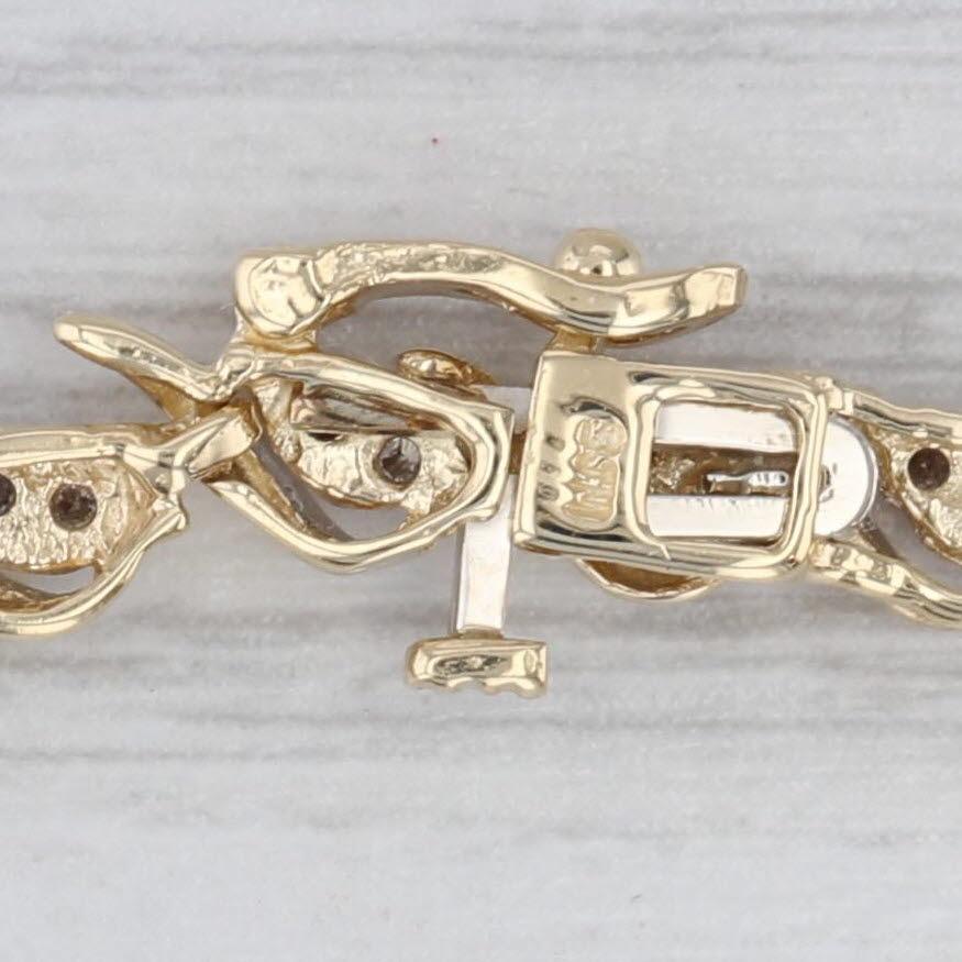 Informationen zu Edelsteinen:
- Natürliche Diamanten -
Karat gesamt - 0,90ctw
Schliff - Rundbrillant
Farbe - L - N
Klarheit - I1 - I2

Metall: 14k Gelbgold
Gewicht: 10,6 Gramm 
Briefmarken: 14k
Kette Stil: Tennis-Armband
Verschluss: 14k
Innerer
