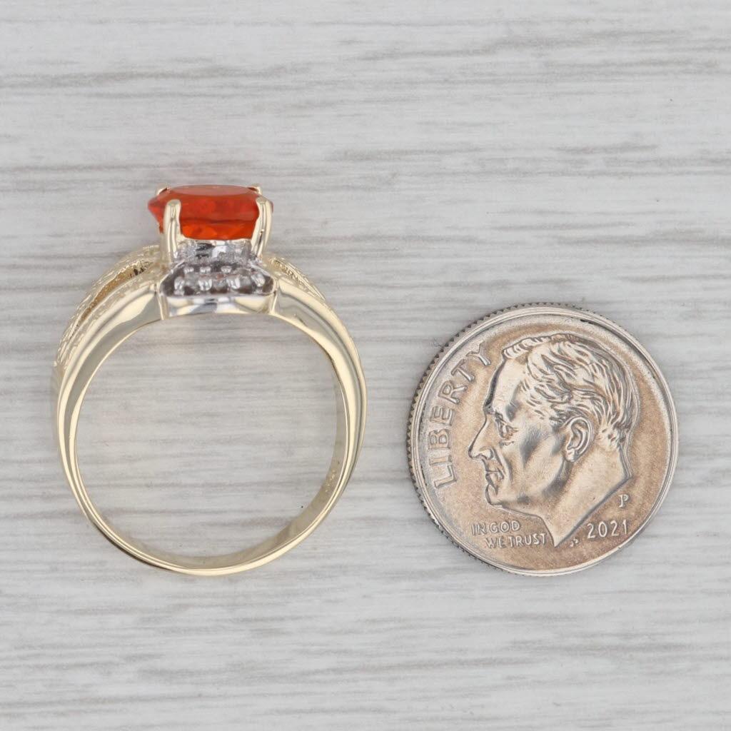 Gemstone Information:
- Natural Fire Opal -
Size - 6 x 8 mm 
Cut - Oval Brilliant
Color - Orange

- Natural Diamonds -
Total Carats - 0.09ctw
Cut - Round Brilliant
Color - G - H
Clarity - I2 

Metal: 14k Yellow white Gold
Weight: 6.1 Grams 
Stamps: