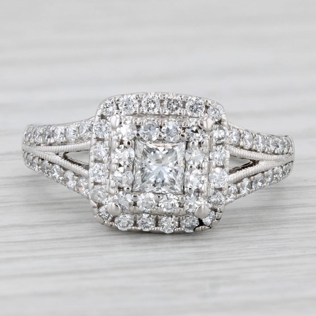 Gemstone Information:
- Natural Diamonds (centers) -
Total Carats - 0.29ctw
Cut - Princess Brilliant
Color - F - G
Clarity - SI2

- Natural Diamonds (halo) -
Total Carats - 0.34ctw
Cut - Single & Round Brilliant
Color - F - G
Clarity - VS2 - SI1

-