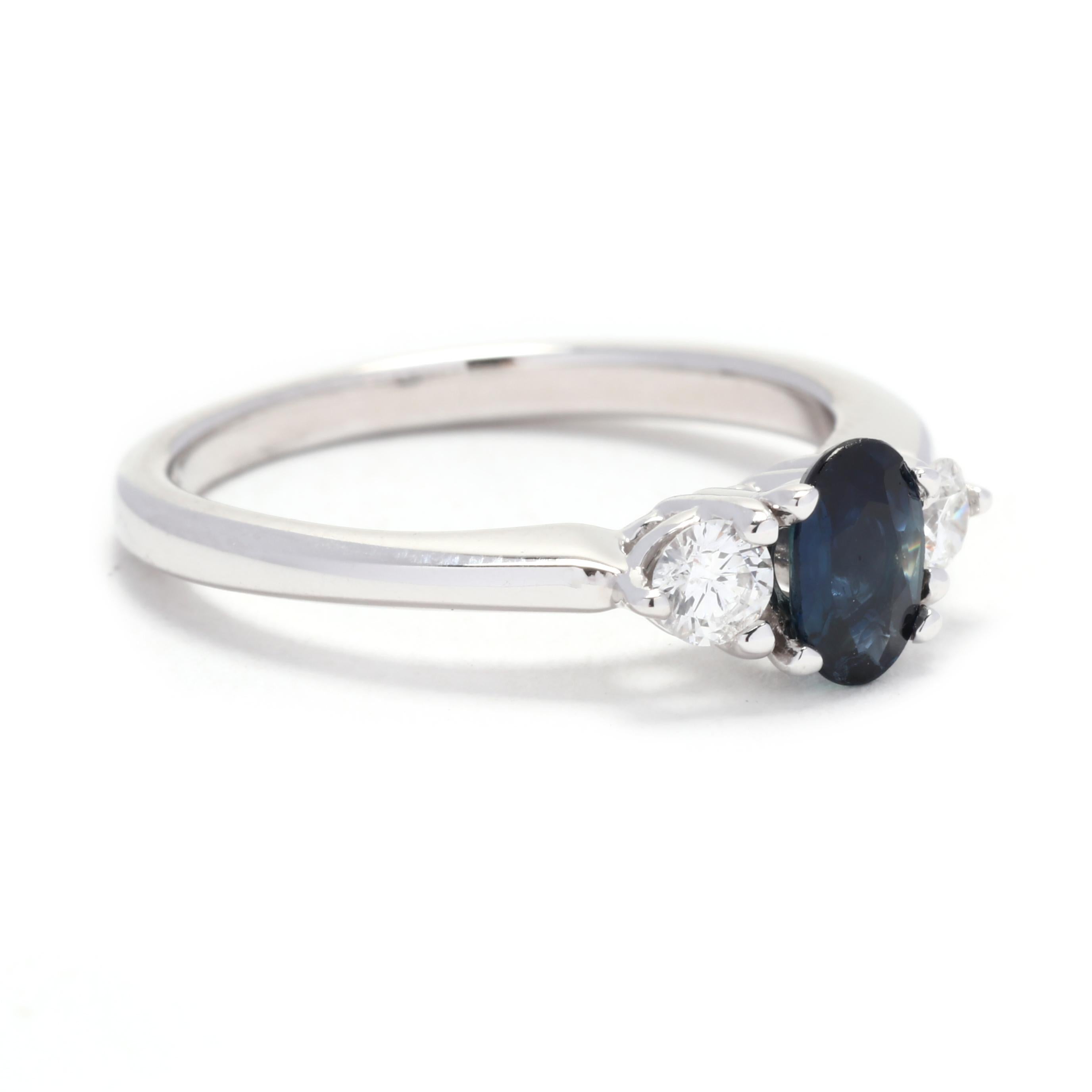 This exquisite 3 stone engagement ring is a timeless symbol of love and commitment. Crafted in 14K white gold, this ring features 0.90 carat sapphires and diamonds. The sapphire and diamonds are of excellent quality, with a color grade of G and a
