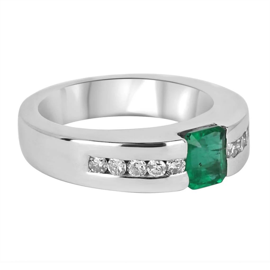 Bold and unique, this men's 14K gold ring says it all. The men's emerald, emerald cut & diamond ring features an excellent design. Securely tension set, the emerald sits within a golden frame and shows a strong green color. Very good eye clarity is