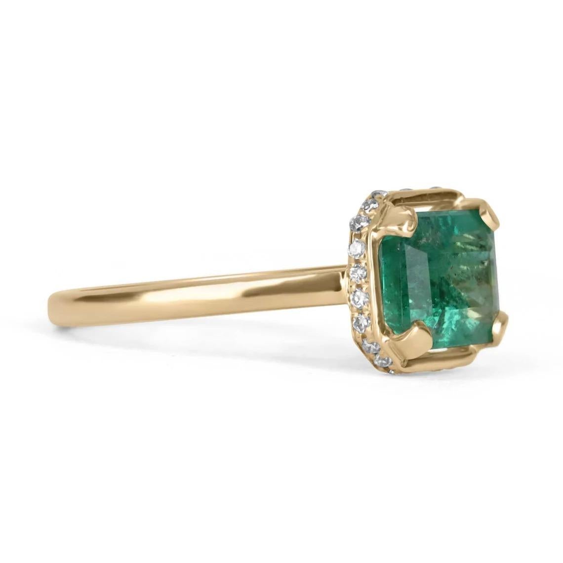 Showcased is a modern, emerald, and diamond accent solitaire ring. This solitaire carries a full 0.80-carat natural emerald cut-Colombian emerald. This gemstone is fully faceted and has an excellent shine. Diamonds accent the ring from the side