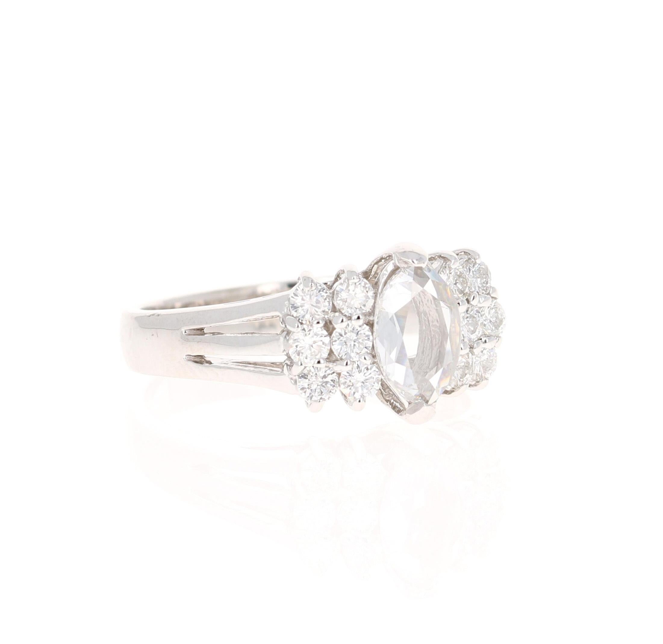 This unique ring has a Marquise Rose Cut Diamond that weighs 0.46 carats. It has 12 Round Cut Diamonds that surround the ring and weighs 0.45 carats. The total carat weight of the ring is 0.91 carats. 

The ring is curated in 14 Karat White Gold and