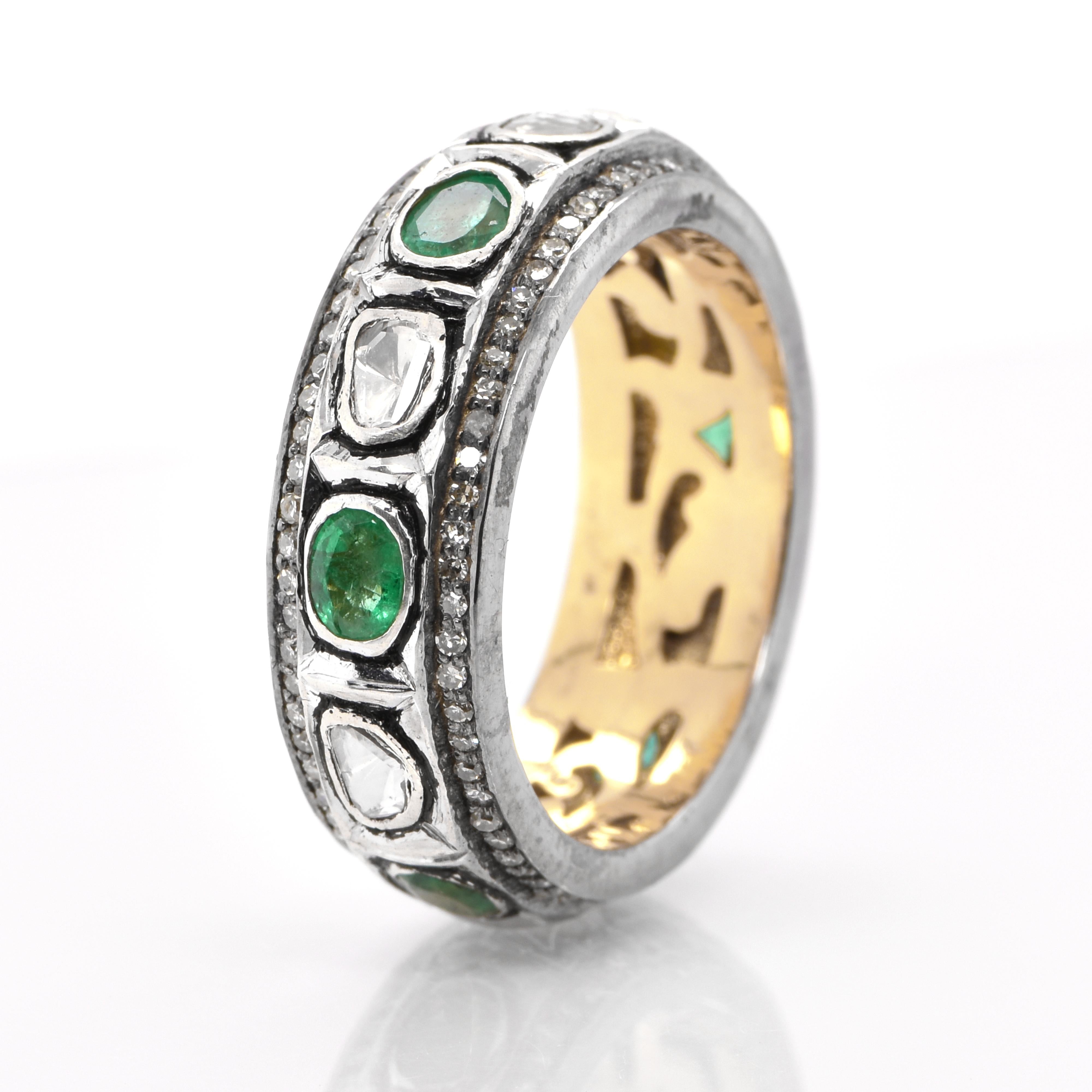 A stunning Victorian Style Eternity ring featuring a total of 0.91 Carats of Natural Emeralds and 0.26 Carats of Polki Diamonds set in Silver and Gold. People have admired emerald’s green for thousands of years. Emeralds have always been associated