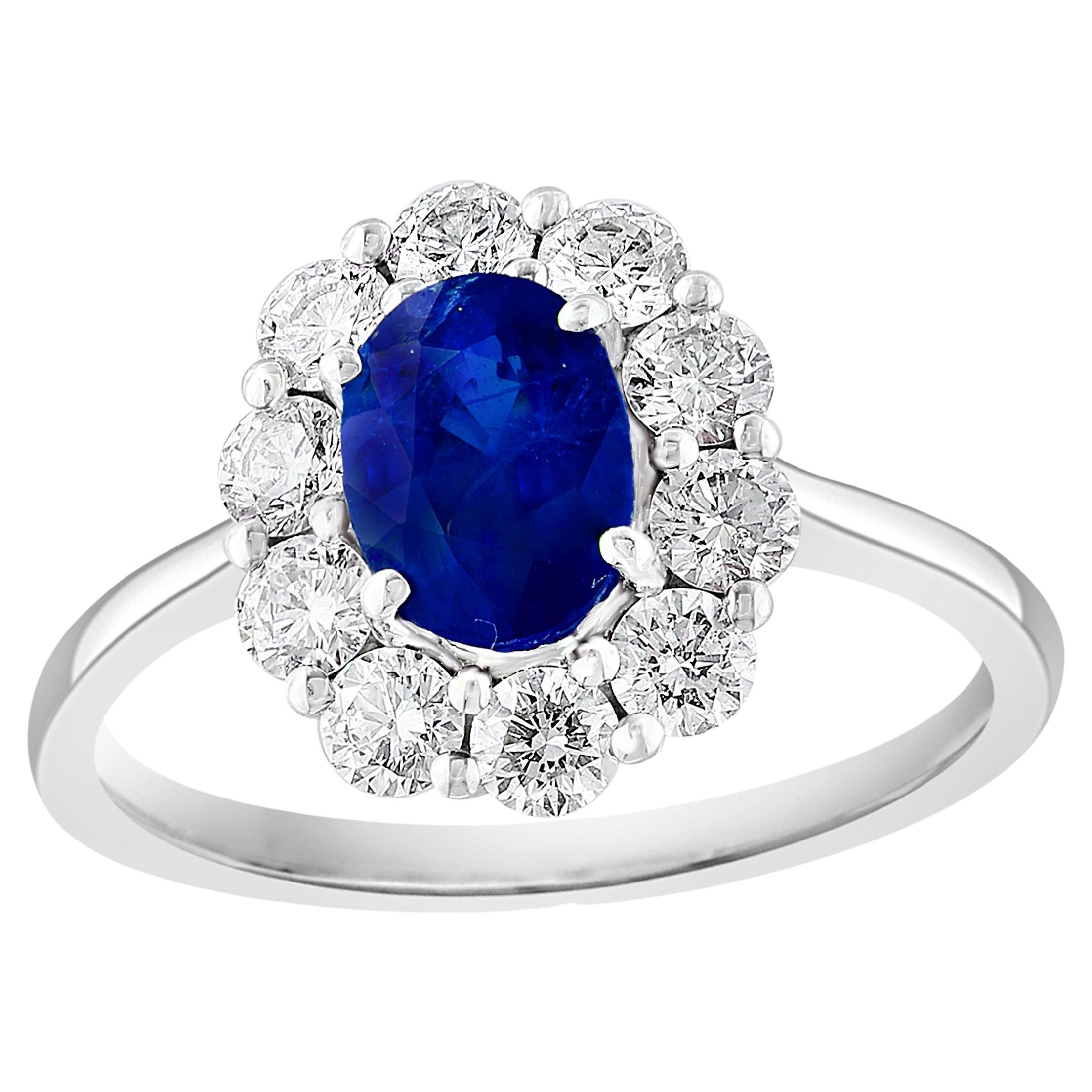 0.91 Carat Oval Cut Blue Sapphire and Diamond Ring in 18k White Gold For Sale