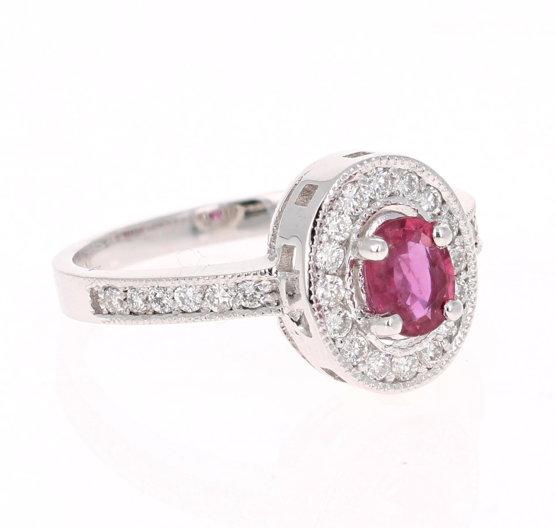 Simply beautiful Ruby Diamond Ring with a Oval Cut 0.54 Carat Burmese Ruby which is surrounded by 28 Round Cut Diamonds that weigh 0.37 carats. The total carat weight of the ring is 0.91 carats. The clarity and color of the diamonds are SI1-F.

The