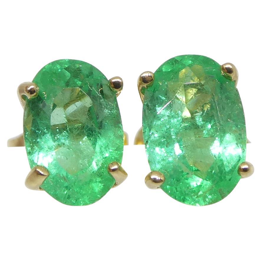 0.91ct Oval Green Colombian Emerald Stud Earrings set in 14k Yellow Gold For Sale