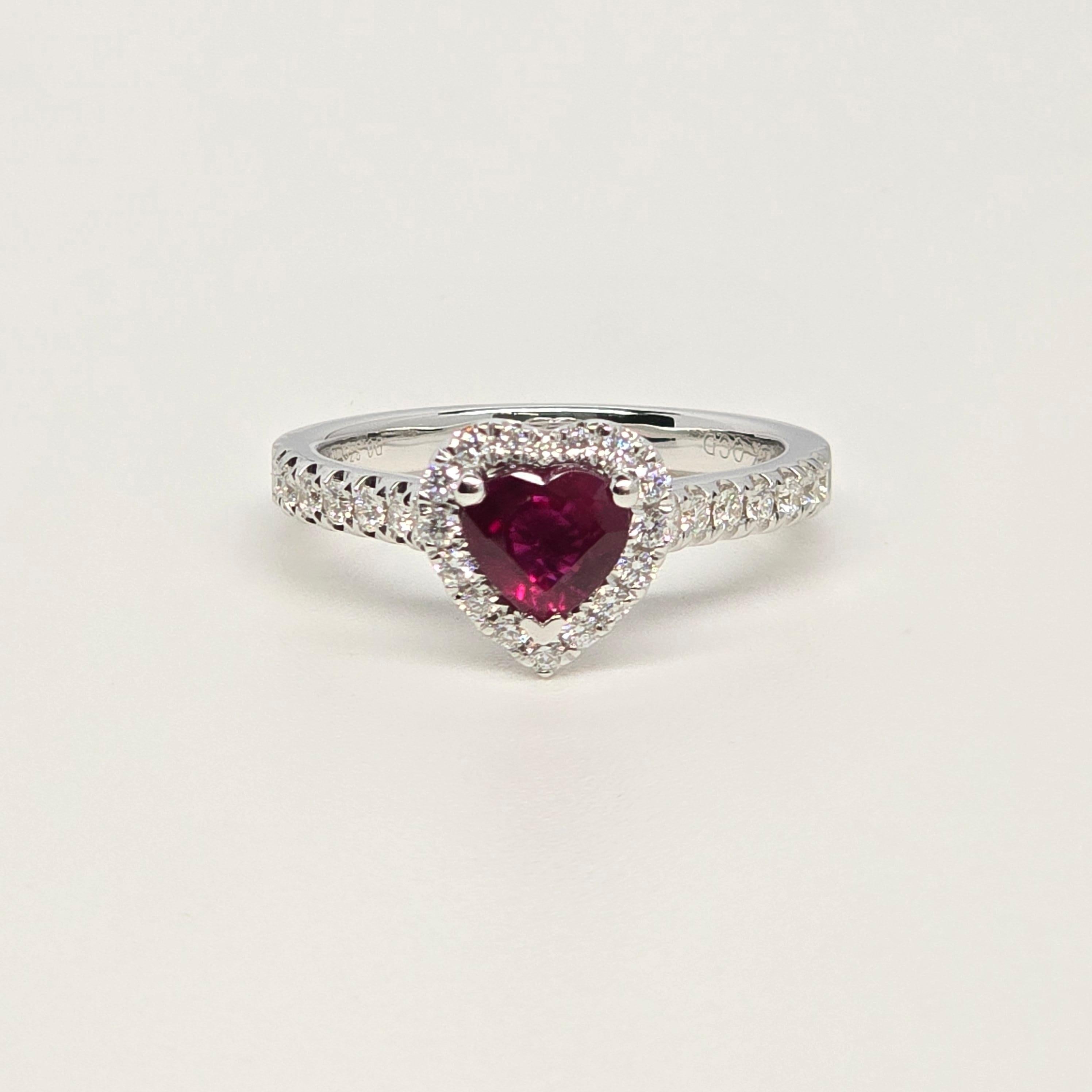 Rare glowing pinkish red ruby hear shaped with a diamond halo in 18KT gold. This ruby is stunning! Size 7 and can be re-sized! Ruby is untreated!


METAL: 18KT white gold

NATURAL DIAMOND(S)
Cut: Round Brilliant
Color: F-G 
Clarity: VS