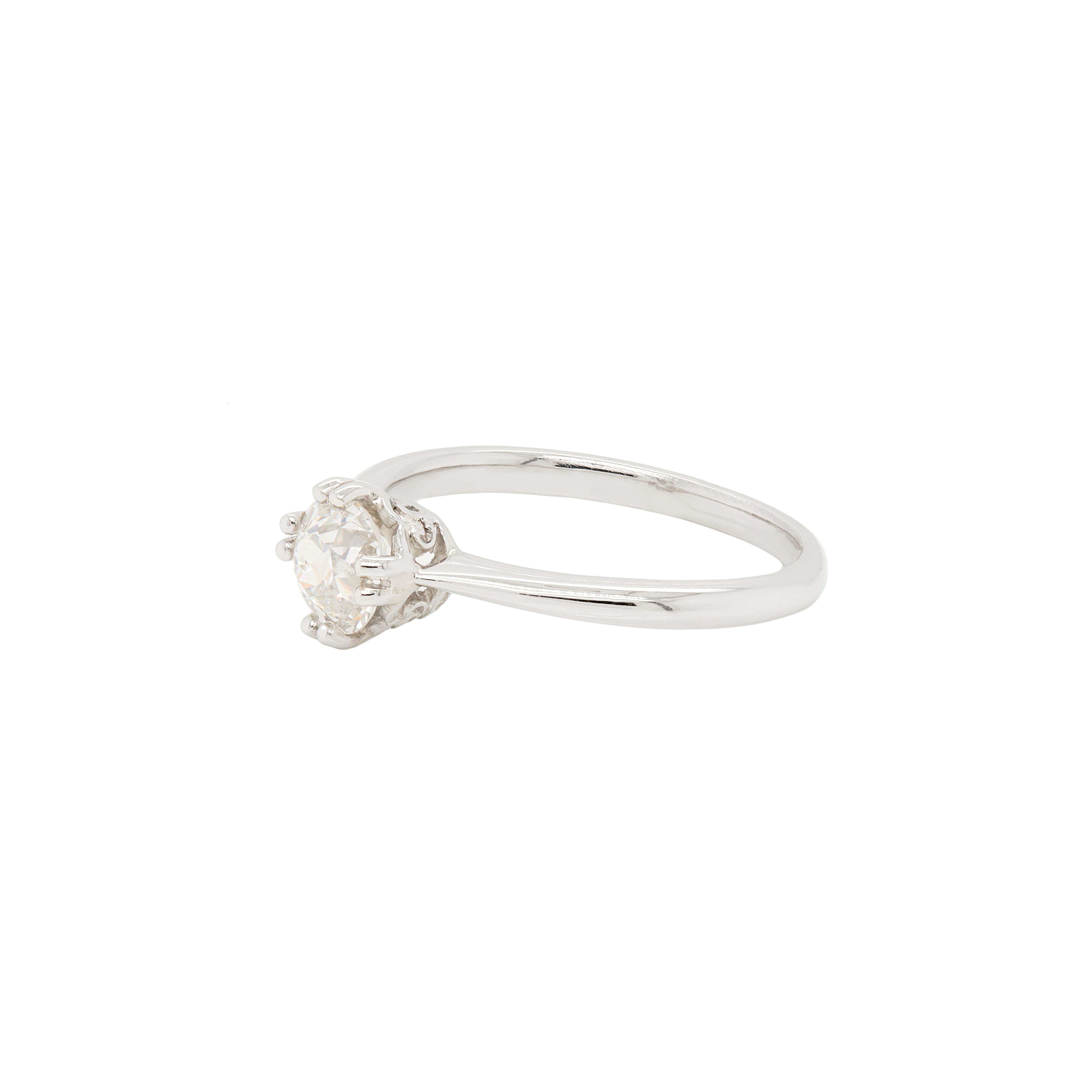 This wonderful engagement ring, masterfully crafted from luxurious platinum, exudes sophisticated appeal and timeless elegance.

At its heart sits proudly a stunning 0.91ct old European cut diamond, securely held in place by a delicate four double