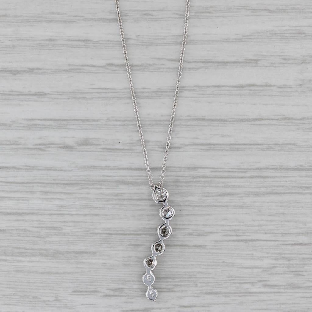 Gemstone Information:
- Natural Diamonds -
Total Carats - 0.91ctw
Cut - Round Brilliant
Color - F - H
Clarity - SI2 - I1
Please note there are surface reaching inclusions.

Metal: 14k White Gold
Weight: 2.7 Grams 
Stamps: 585 14k
Chain Style: Cable