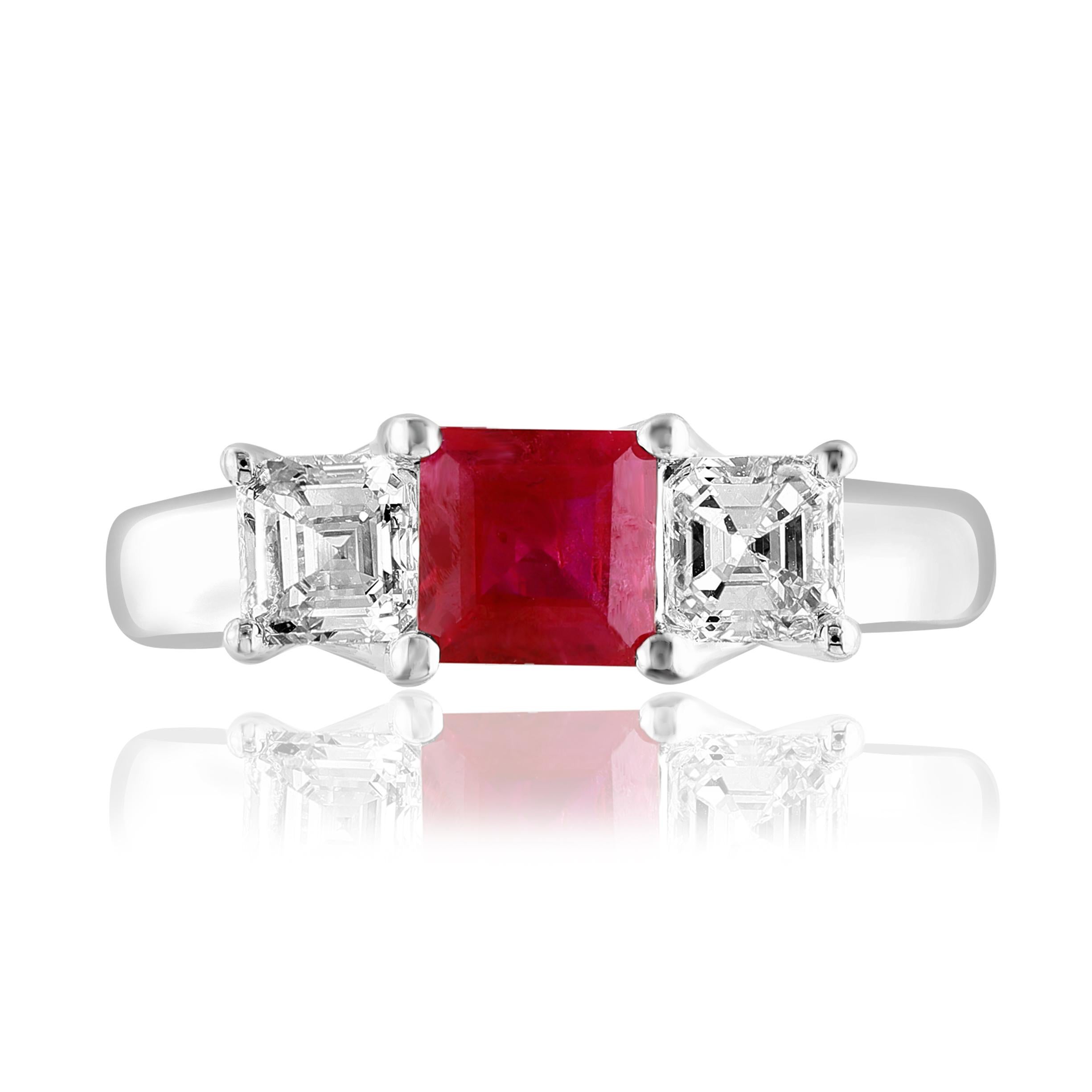 Showcasing Emerald cut, Vibrant color Ruby weighing 0.92 carats, flanked by two brilliant cut asher diamonds weighing 0.86 carats total. Elegantly set in a polished 14K White Gold.
