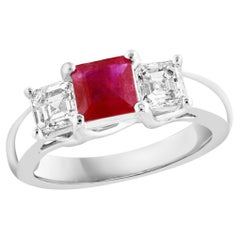 0.92 Carat Emerald Cut Ruby and Diamond Three-Stone Engagement Ring in 14K