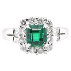 0.92 Carat Natural Vivid Green Emerald and Diamond Ring Set in Platinum
