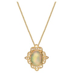 0.92 Carat Oval Cab Ethiopian Opal with Diamond Accents 10K Yellow Gold Pendant