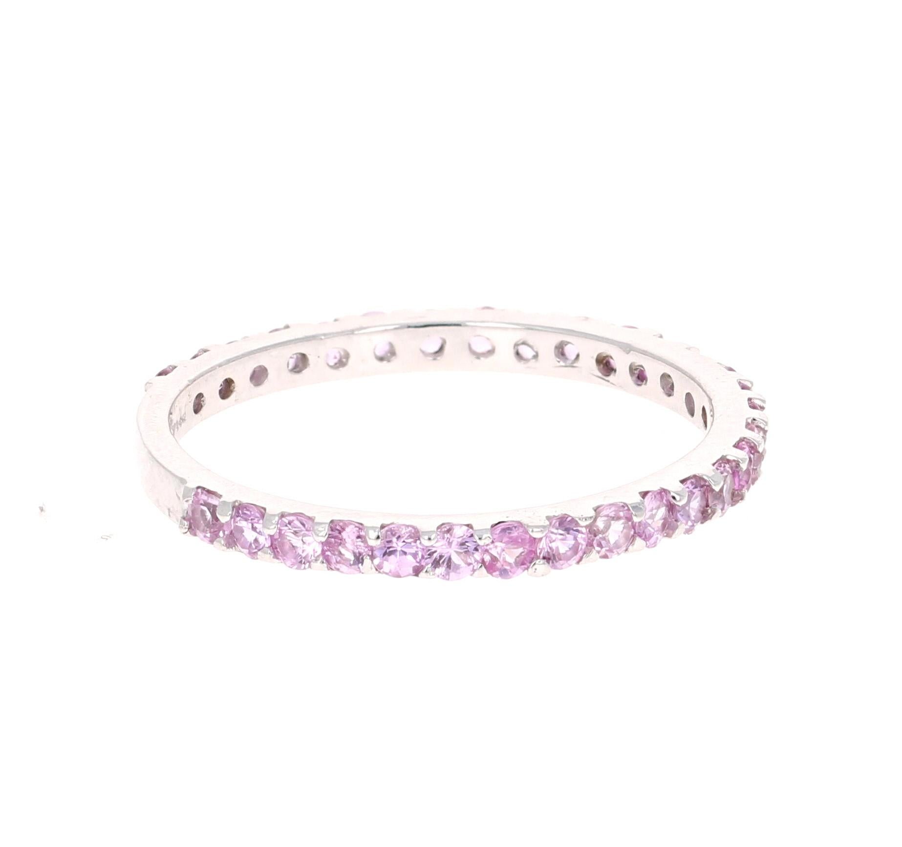Simple, dainty and beautiful! 

This ring has 30 Pink Sapphires that weigh 0.92 Carats. 

Crafted in 14 Karat White Gold and is approximately 1.4 grams 

The ring is a size 7 and can be re-sized at no additional charge!