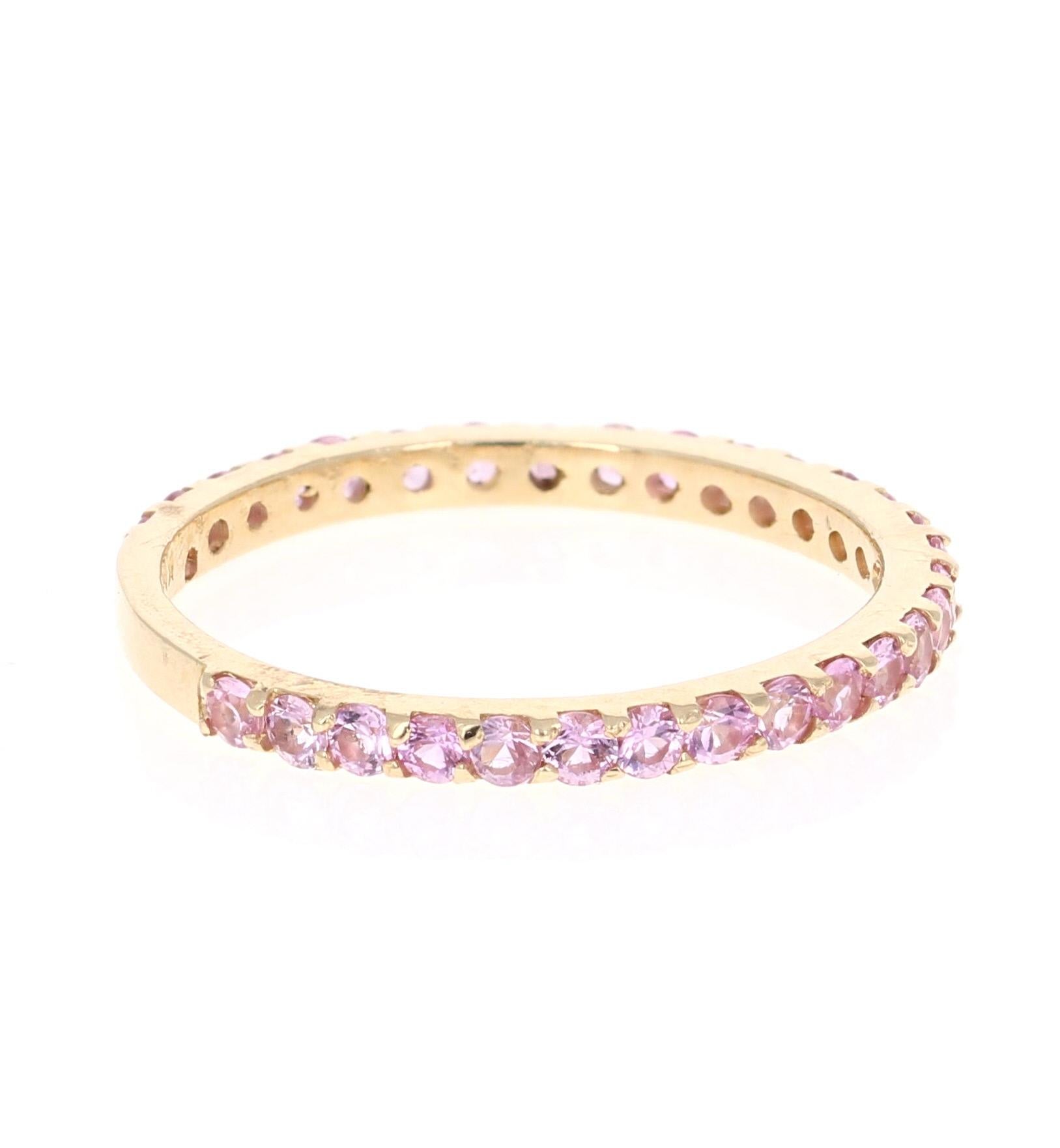 Simple, dainty and beautiful! 

This ring has 30 Pink Sapphires that weigh 0.92 Carats. 

Crafted in 14 Karat Yellow Gold and is approximately 1.4 grams 

The ring is a size 7 and can be re-sized at no additional charge!