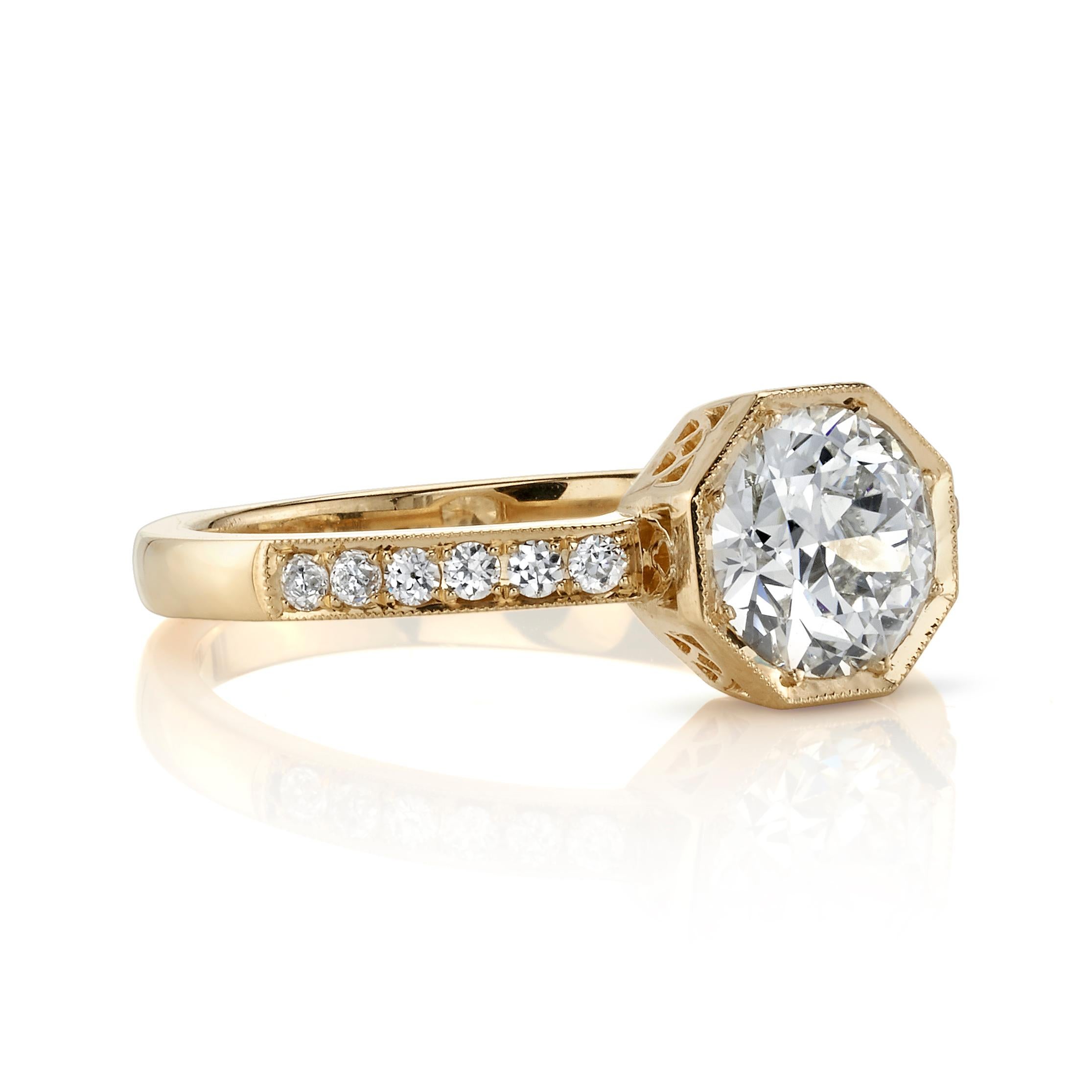 0.92ctw J/VVS2 GIA certified old European cut Diamond set in a handcrafted 18K yellow gold mounting. 0.12ctw old European cut accent diamonds rest on both sides of the upper shank of the ring.

Ring is currently a size 6 and can be sized to fit.