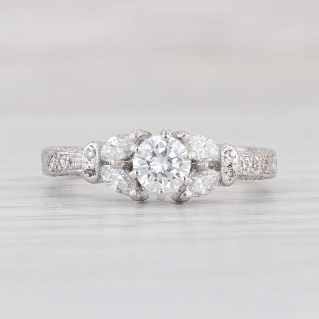 Gemstone Information:
- Natural Diamond -
Carats - 0.53ct 
Cut - Round Brilliant
Color - H - I
Clarity - SI1 

- Natural Diamonds -
Total Carats - 0.39ctw
Cut - Marquise 0.26ctw, Round Brilliant 0.13ctw
Color - G - H
Clarity - VS2 - SI1

Metal: 950