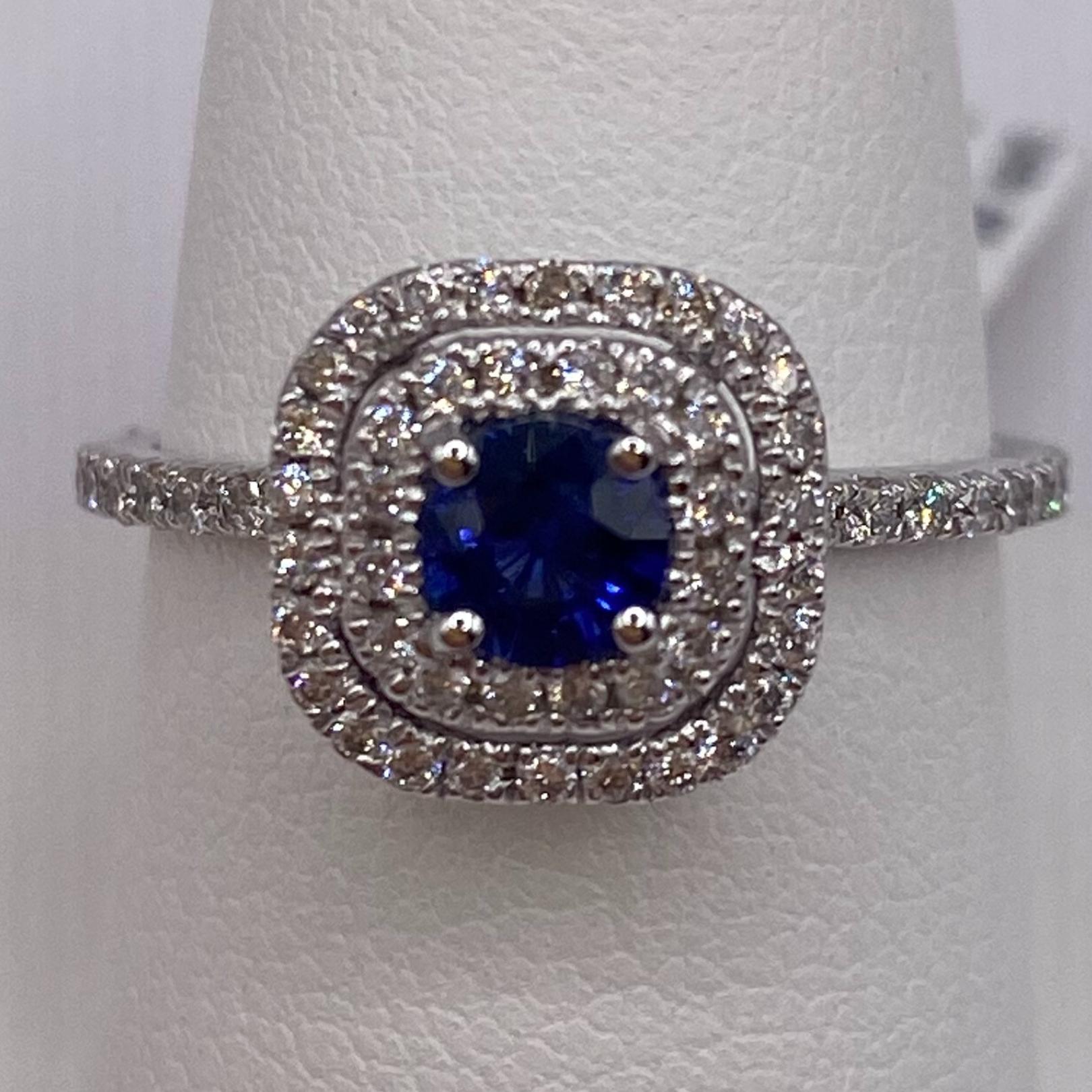 18KT White Gold
Finger Size: 6.5
Band Width: 1.5mm
(ring is size 6.5, but is sizable upon request)

Number of Round Sapphires: 1
Carat Weight: 0.46ctw
Stone Size: 4.4mm

Number of Round Diamonds: 0.70ctw
Diamond Weight: 0.46ctw