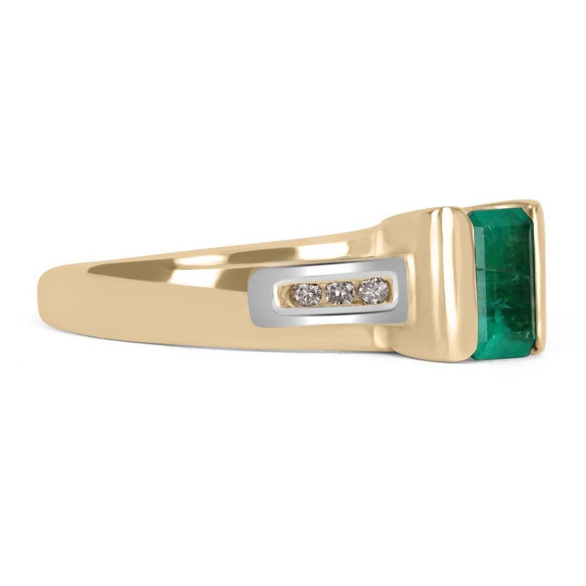 A unique Colombian emerald and diamond ladies' ring. A beautiful, medium-light green Colombian emerald weighing approximately 0.86-carats, with diamond accents on each side. The Colombian emerald is tension-set in a 14K yellow and white gold