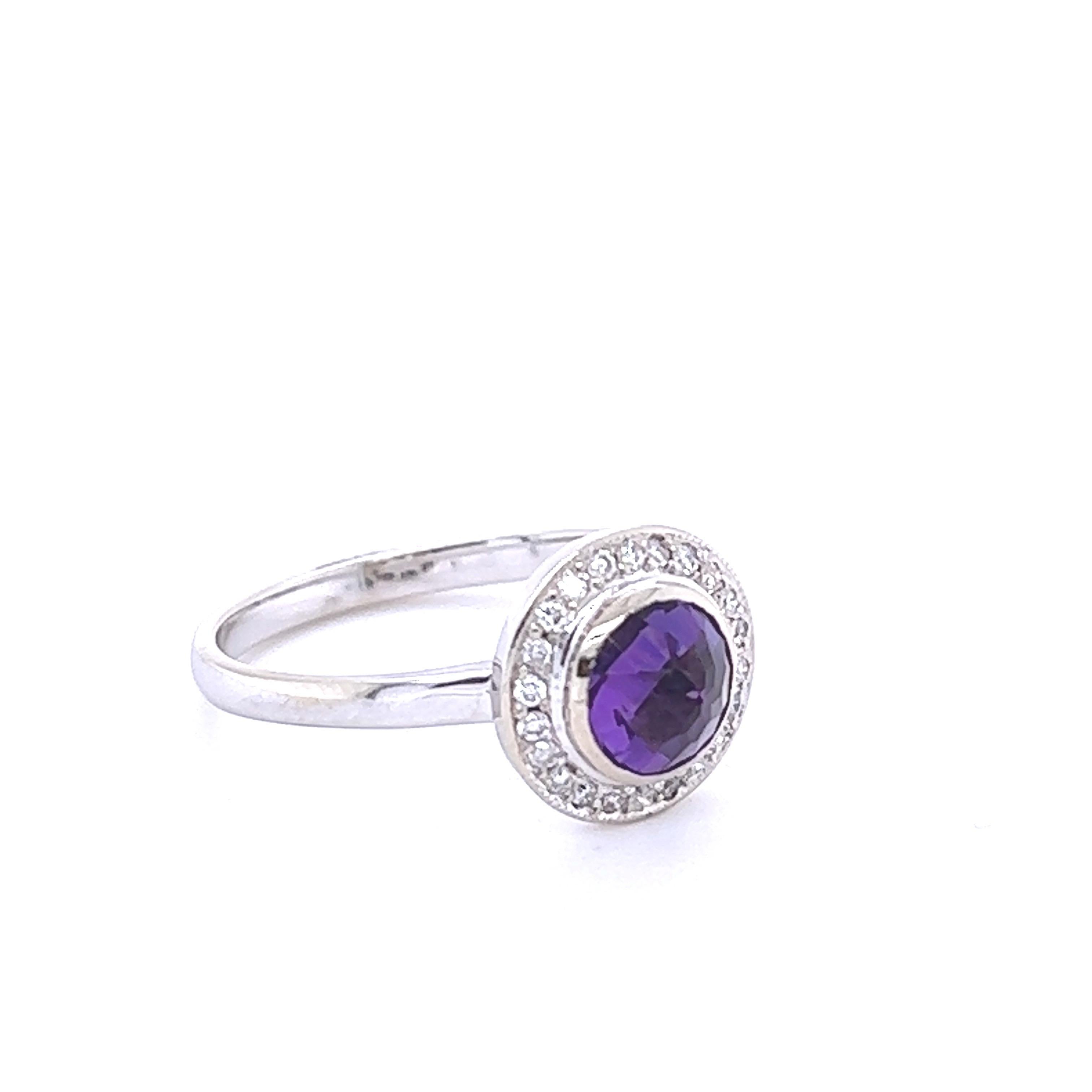 This beautiful ring has a 0.78 carat Round Cut Amethyst set in the center and is surrounded by 23 Round Cut Diamonds that weigh 0.15 carats. The total weight of the ring is 0.93 carats. The center Amethyst measures at approximately 5.5 mm. The ring