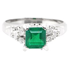 Vintage 0.93 Carat Natural Emerald and Diamond Halo Ring Set in Platinum
