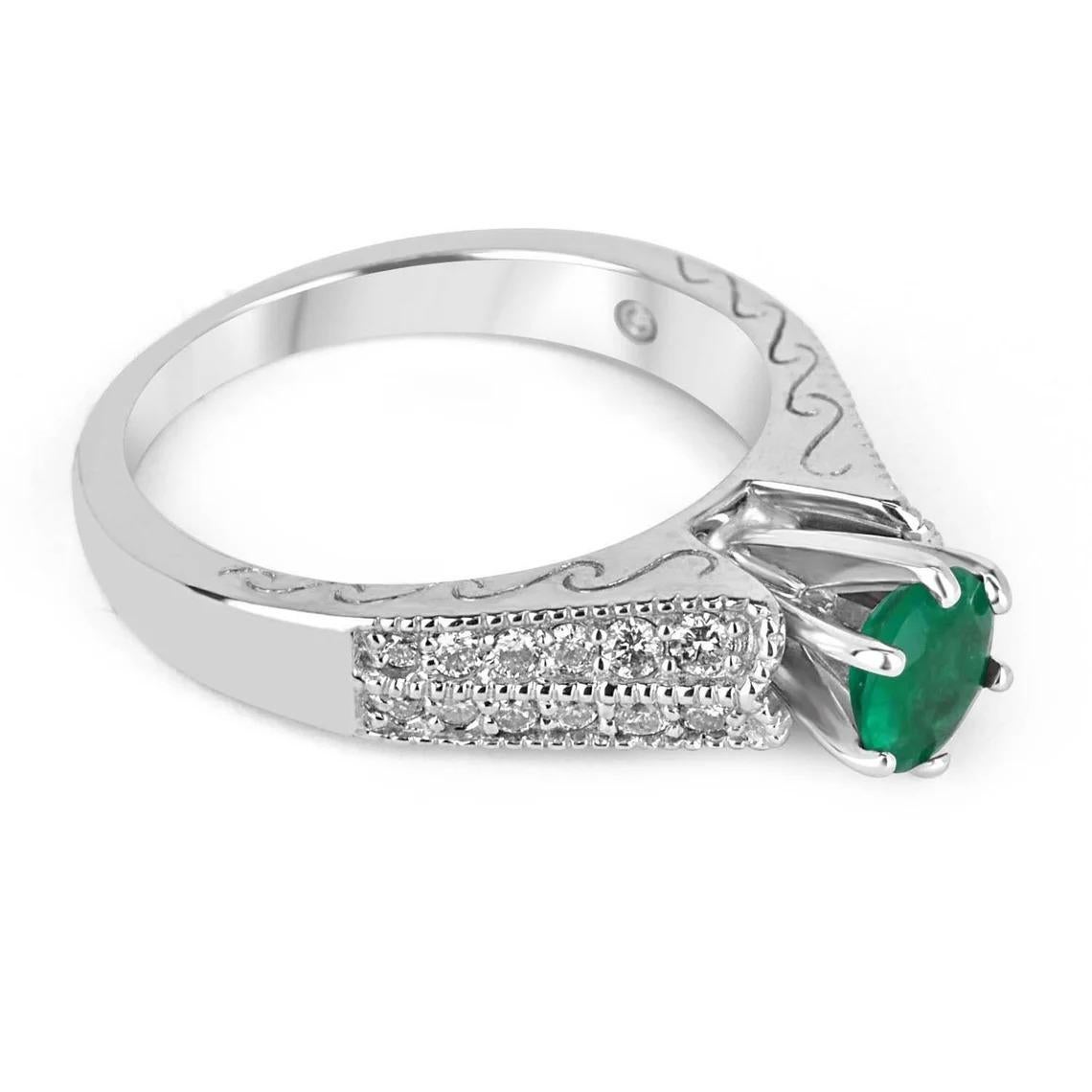 A Colombian emerald & diamond accent 14K white gold engagement ring. This ring takes 'solitaire with accents' to another level. The earth mined, Colombian Emerald is prong-set in a six-prong setting, not only is this the most secure way to set a