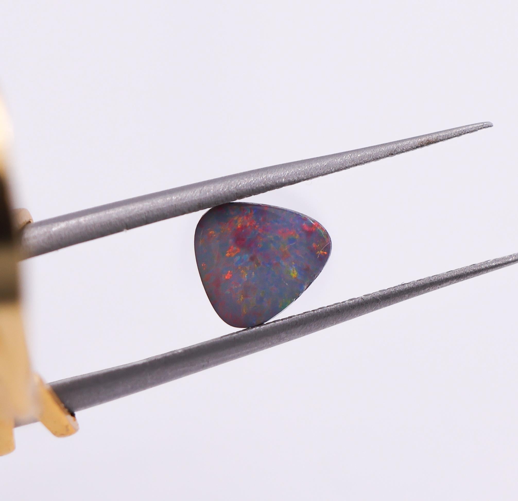 Trillion Cut 0.94 Carat Australian Boulder Opal Loose Gemstone Trillion 7x6.5mm For Sale