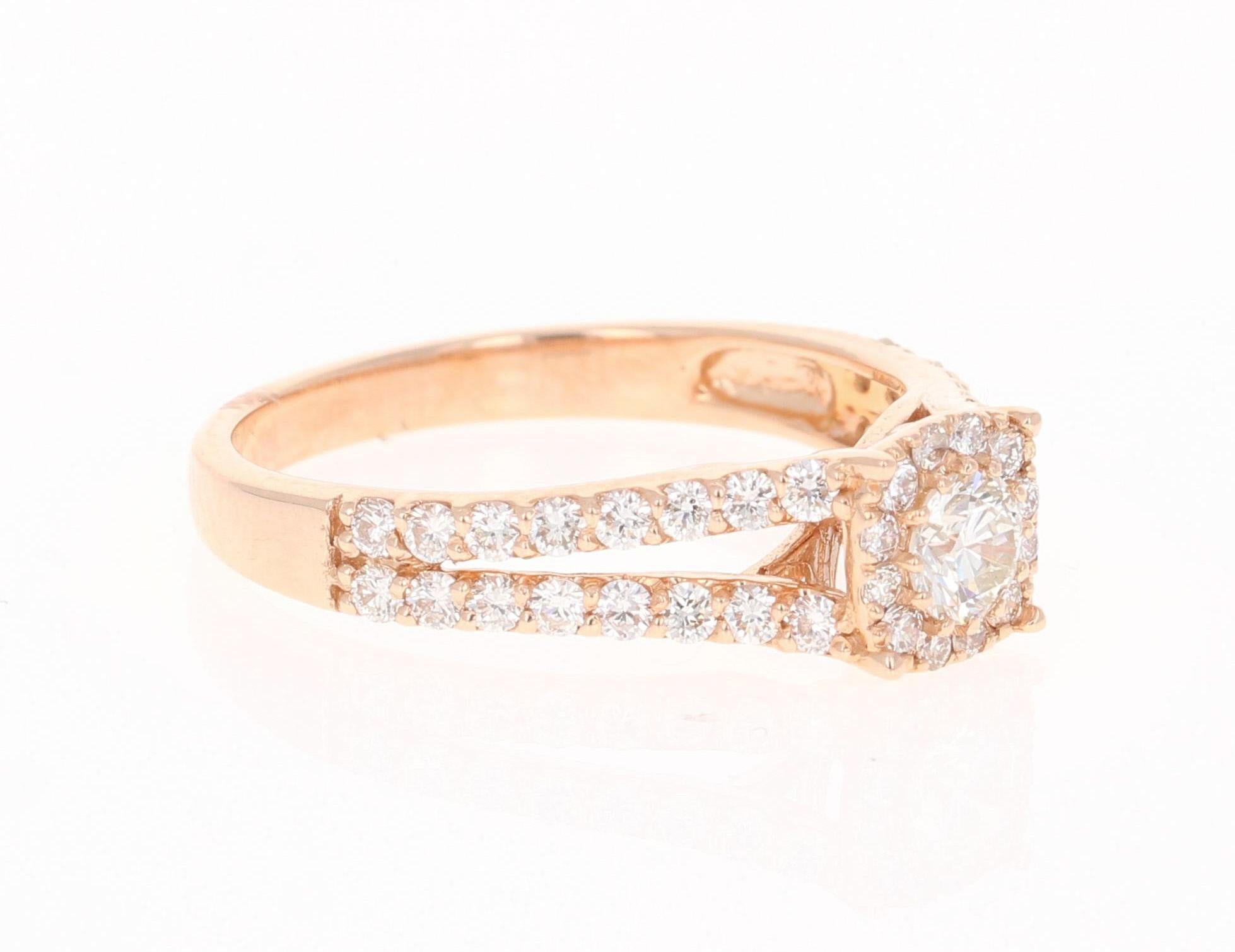 This unique Cluster ring has 45 Round Cut Diamonds that weigh 0.94 Carats.  The Cluster setting makes the center Diamond look well over a carat.   The Clarity is VS2 and the Color is H.

It is beautifully set in 14 Karat Rose Gold and weighs