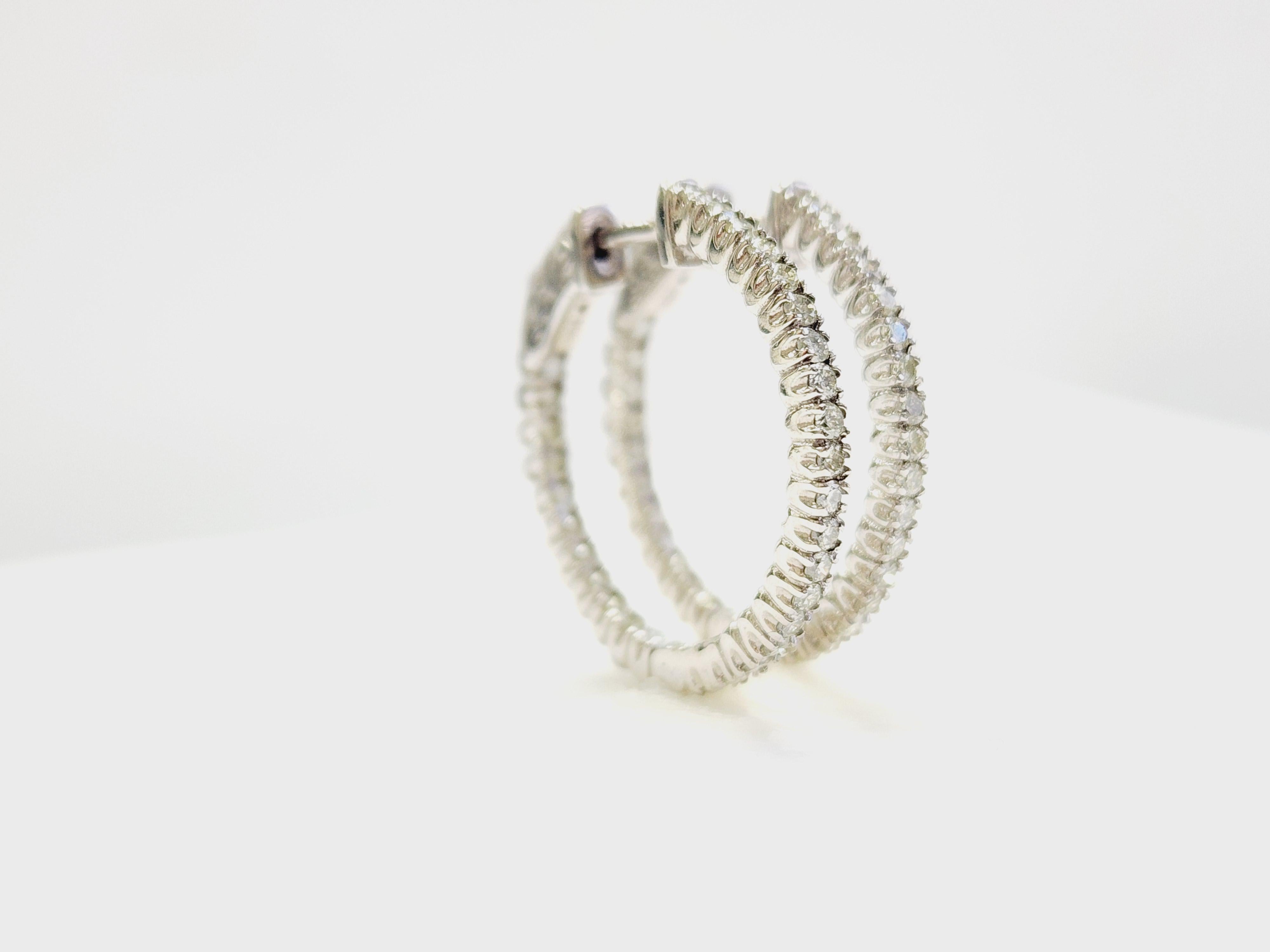 Inside Out Natural Diamond Hoop Earrings 14K White Gold I/SI Snap Closure

Beautiful pair of inside-out hoop earrings crafted in solid 14K white gold, featuring natural diamonds with an average color grade of I and clarity SI. Sparkling from every