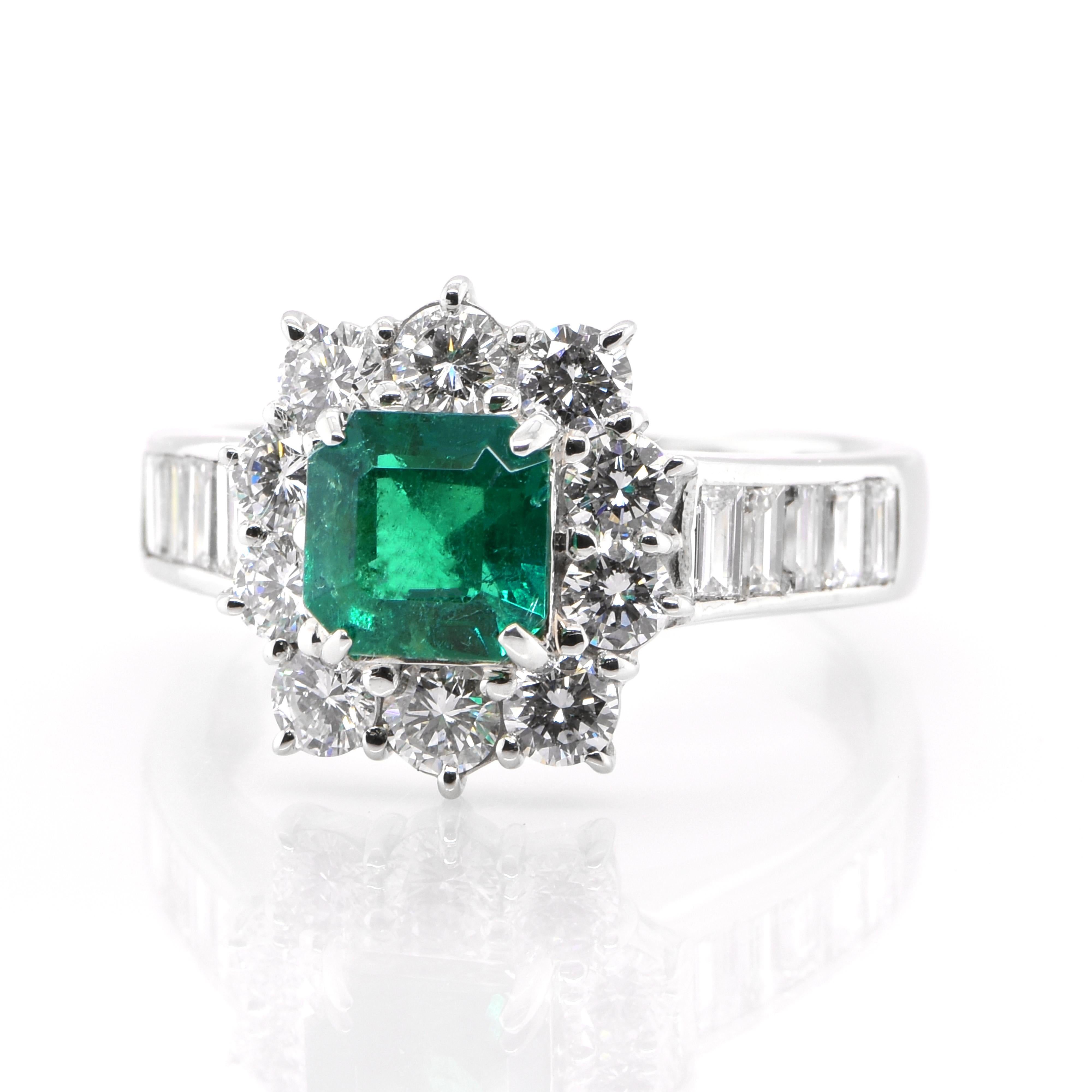 A stunning Engagement ring featuring a 0.94 Carat, Natural, Emerald and 1.28 Carats of Diamond Accents set in Platinum. The Emerald displays very good color and clarity which is rare for most Emeralds set in jewelry! The ring is great for everyday