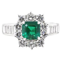 0.94 Carat Natural Emerald and Diamond Halo Ring Set in Platinum