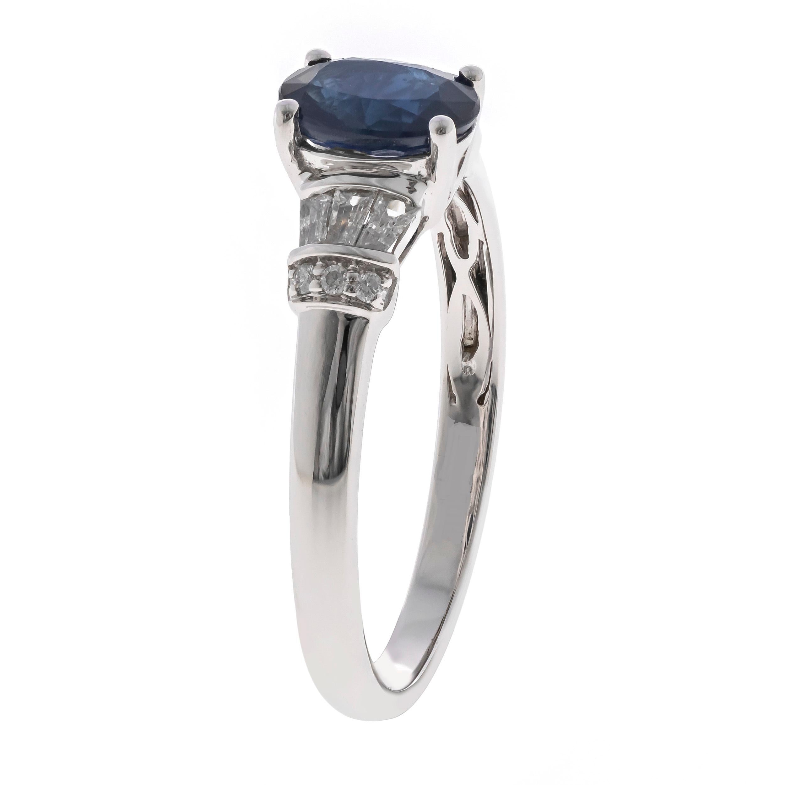 Decorate yourself in elegance with this Ring is crafted from 10-karat White Gold Gold by Gin & Grace. This Ring is made up of Oval-cut (1 pcs) 0.94 carat Blue Sapphire and Round Cut Diamond (6 Pcs) 0.03 Carat, Baguette-cut White Diamond (6 pcs) 0.16