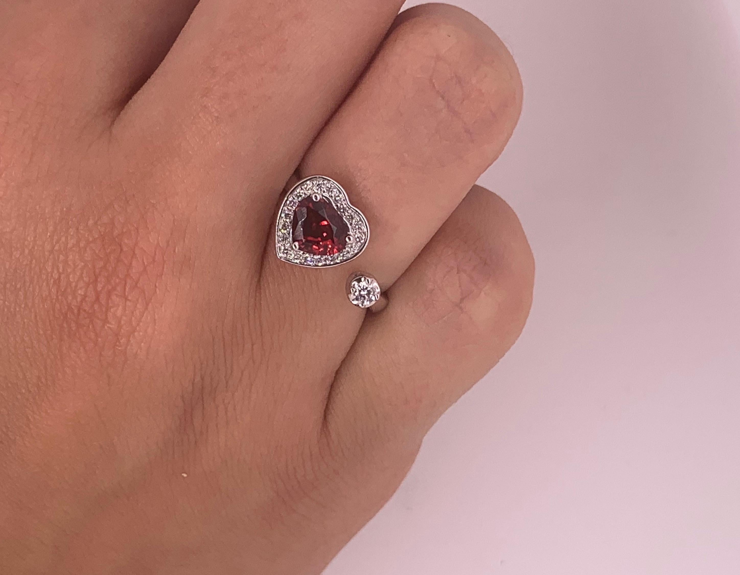 Material: 14K White Gold
Gemstone Details: 1 Pear Shaped Spinel at 0.94 Carats - Measuring 5.6 x 6.5 mm
Diamond Details: 20 Brilliant Round White Diamonds at 0.13 Carats. SI Clarity / H-I Color. 
Diamond Details: 1 Brilliant Round White Diamond at