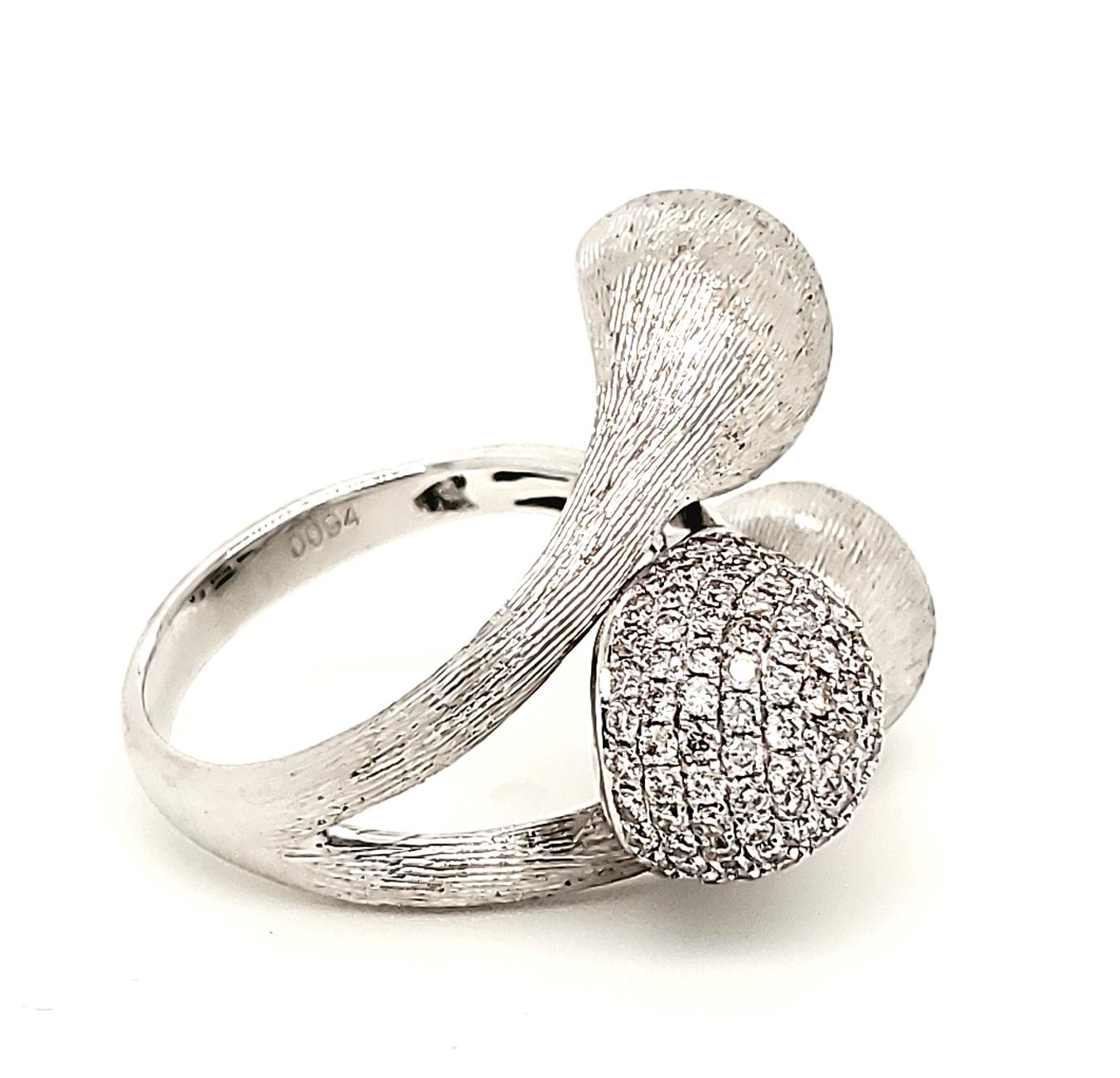 The 0.94 Carat White Diamond and White Gold Modern Fashion Ring features a unique sphere shape design. Two balls are made of 18k white gold while the third ball is covered in white diamonds. This stunning ring puts a modern twist on luxury diamond