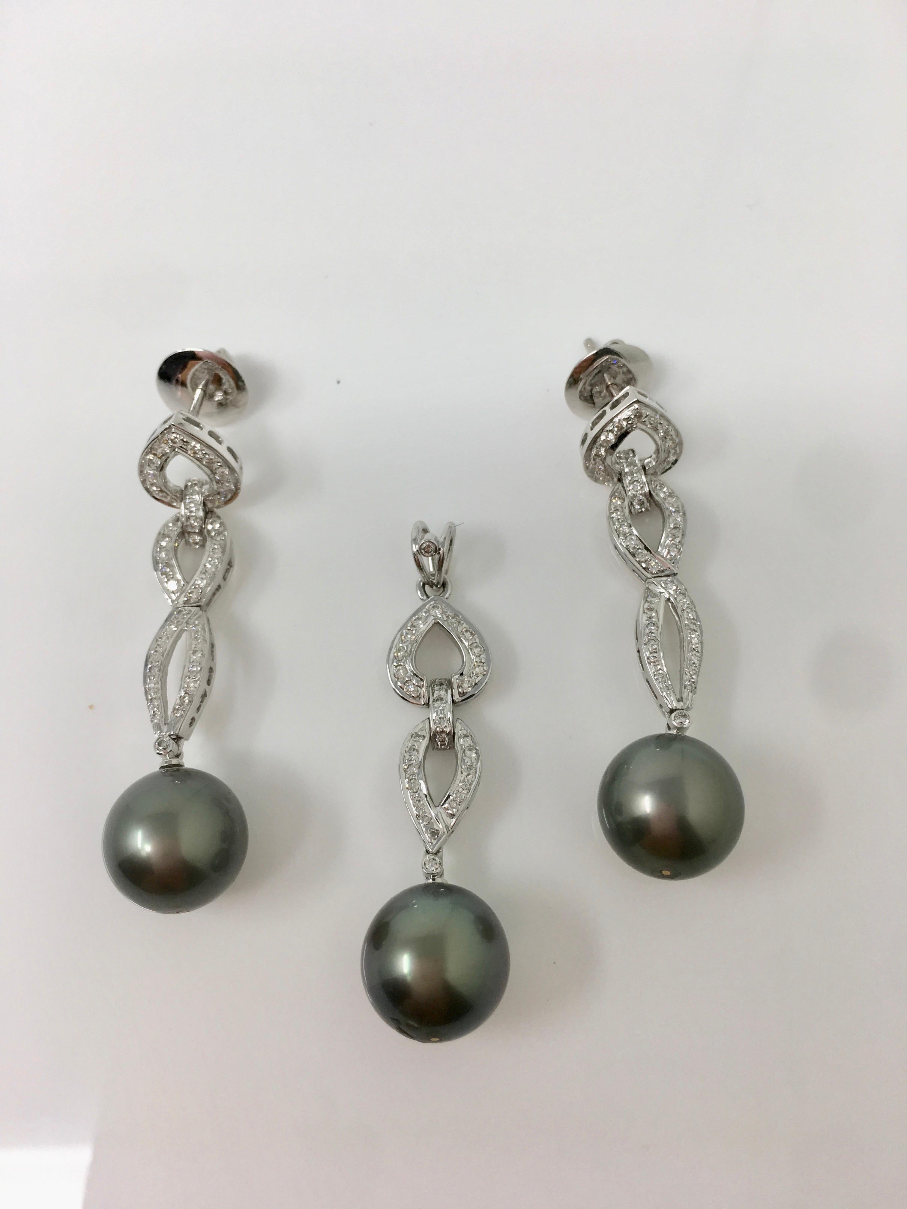 This fabulous white round brilliant diamond weighing 1.68 carat with VS clarity, GH color and gray south sea pearls ( three 11.6mm each ) three piece pendant set  includes a pendant and a pair of earrings. The length of the earrings and the pendant