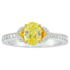 0.94 GIA Certified Fancy Yellow Round and Pave Side-stone Diamond Ring