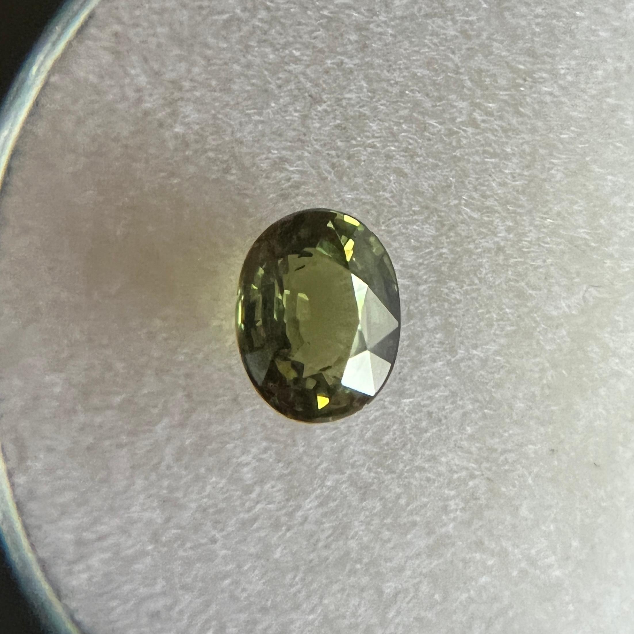 Fine Natural Yellow Green Sapphire Gemstone.

0.94 Carat with a beautiful vivid green yellow colour and excellent clarity, a very clean stone.

Also has an excellent oval cut and ideal polish to show great shine and colour, would look lovely in