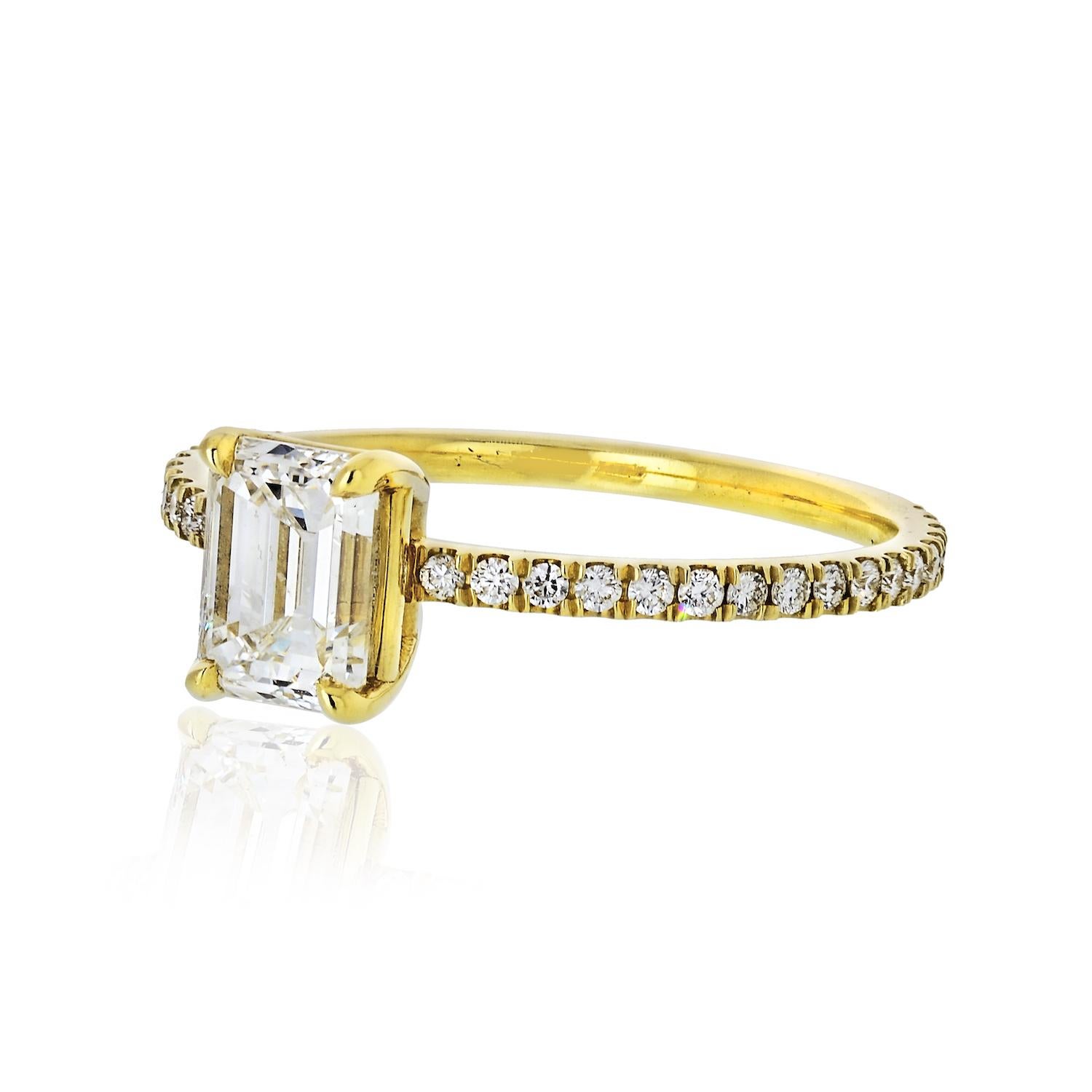 Containing one bright and beautiful Emerald Cut Diamond (.95 Cts.), GIA Certified G SI-1.    The ring shank is set 3/4 around with 34 Brilliant Diamonds (.11 Cts.).  

Size: 6.5