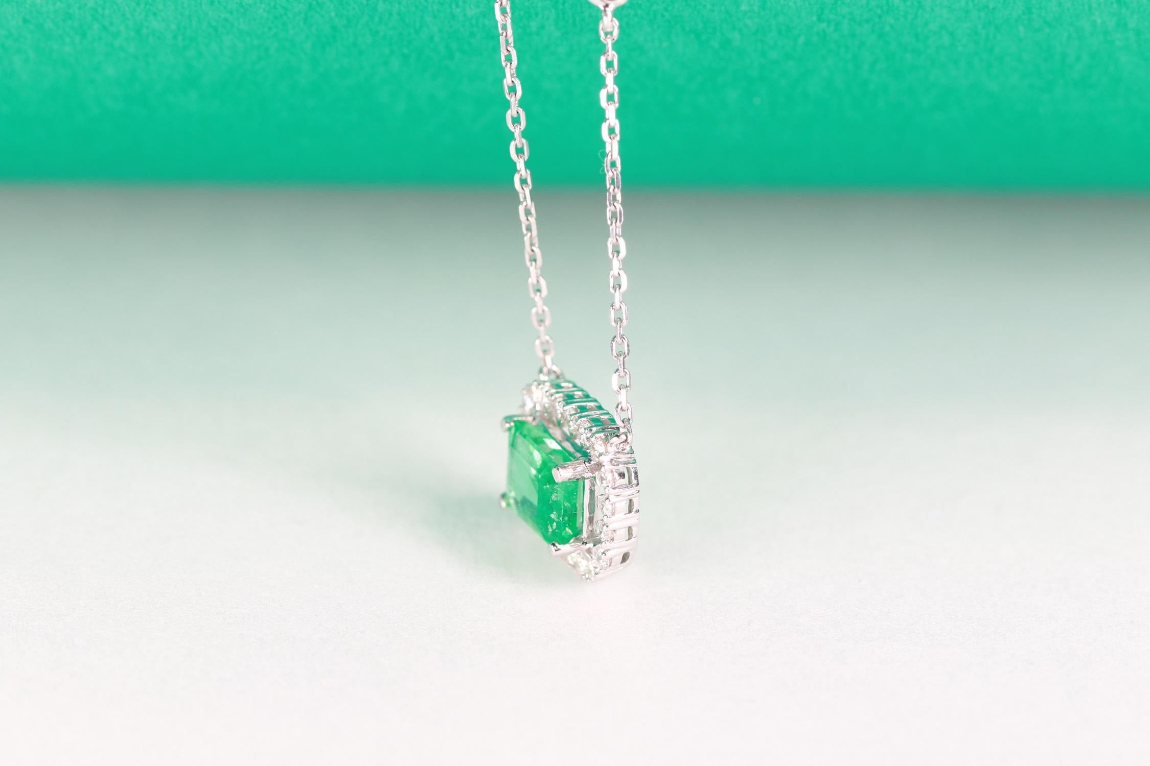 Decorate yourself in elegance with this Pendant is crafted from 18-karat White Gold by Gin & Grace Pendant. This Pendant is made up of 7x5 mm Emerald-Cut Prong setting Emerald (1 Pcs) 0.95 Carat and Round-Cut Prong setting White Diamond (22 Pcs)