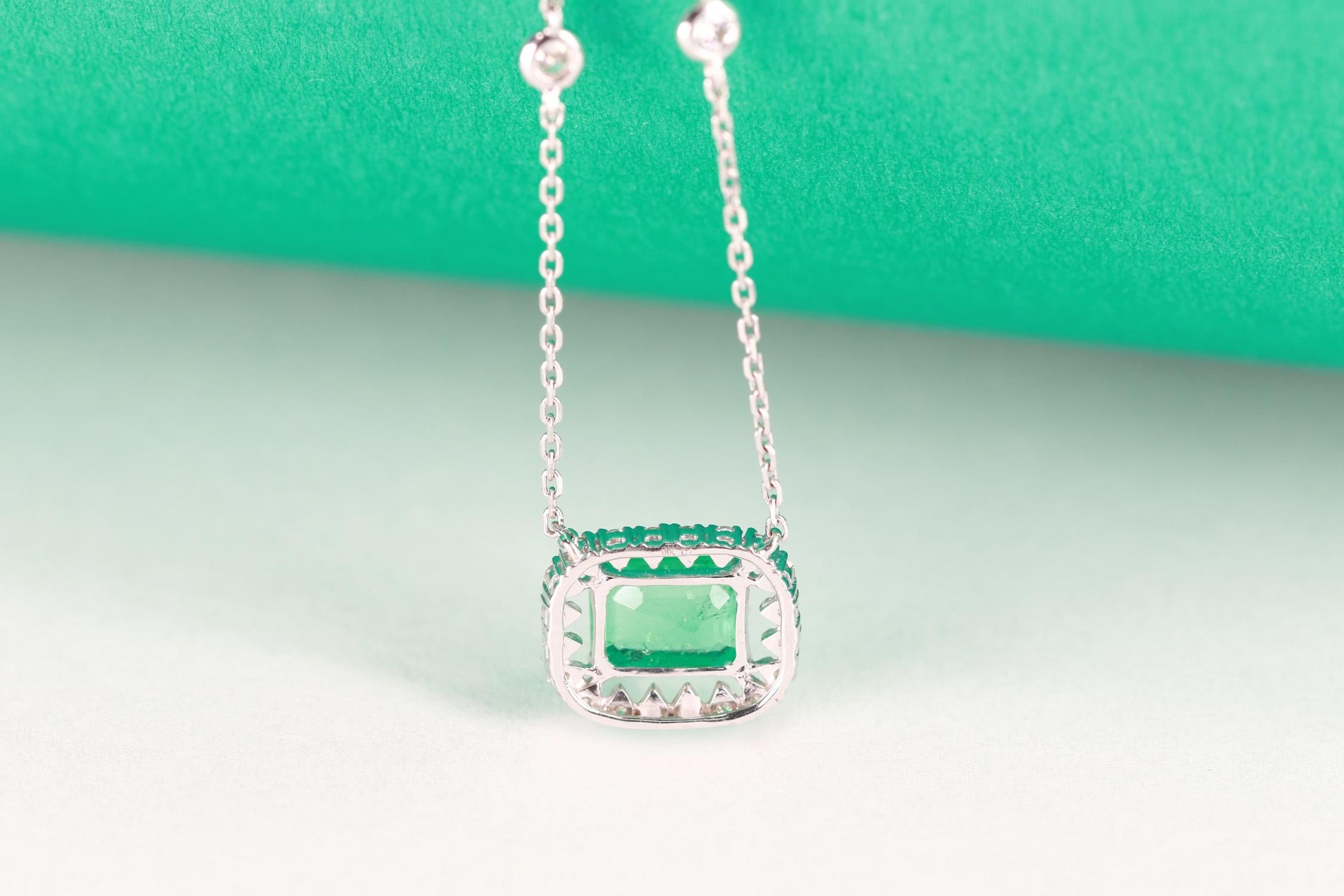 Art Deco 0.95 Carat Emerald Cut Emerald Diamond Accents 18K White Gold Pendant