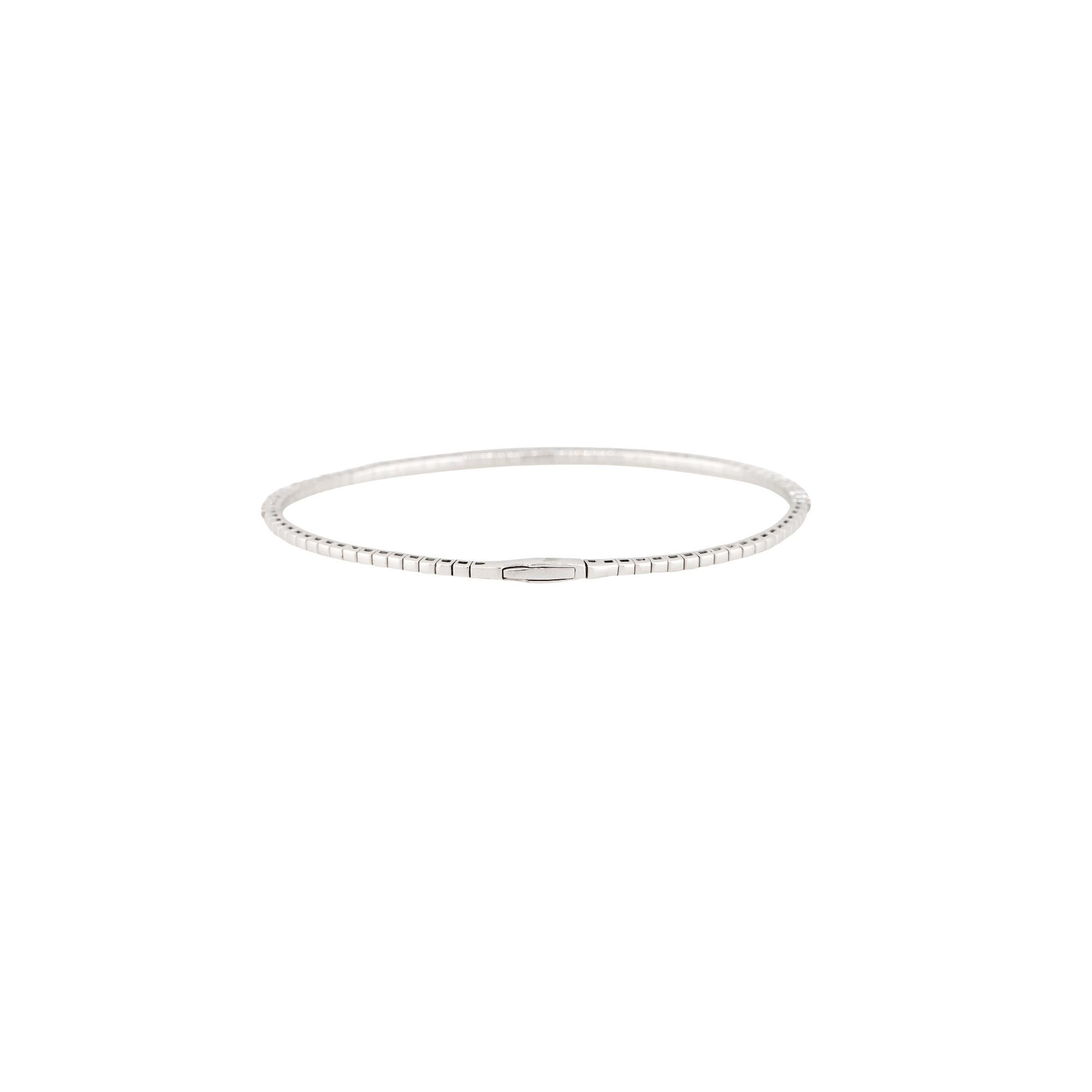 14k White Gold 0.95ctw Flexible Diamond Stackable Bangle Bracelet

Material: 14k White Gold
Diamond Details: Approximately 0.95ctw of Round Brilliant Diamonds. There are 51 Diamonds total. Diamonds are approximately G/H in Color and SI in