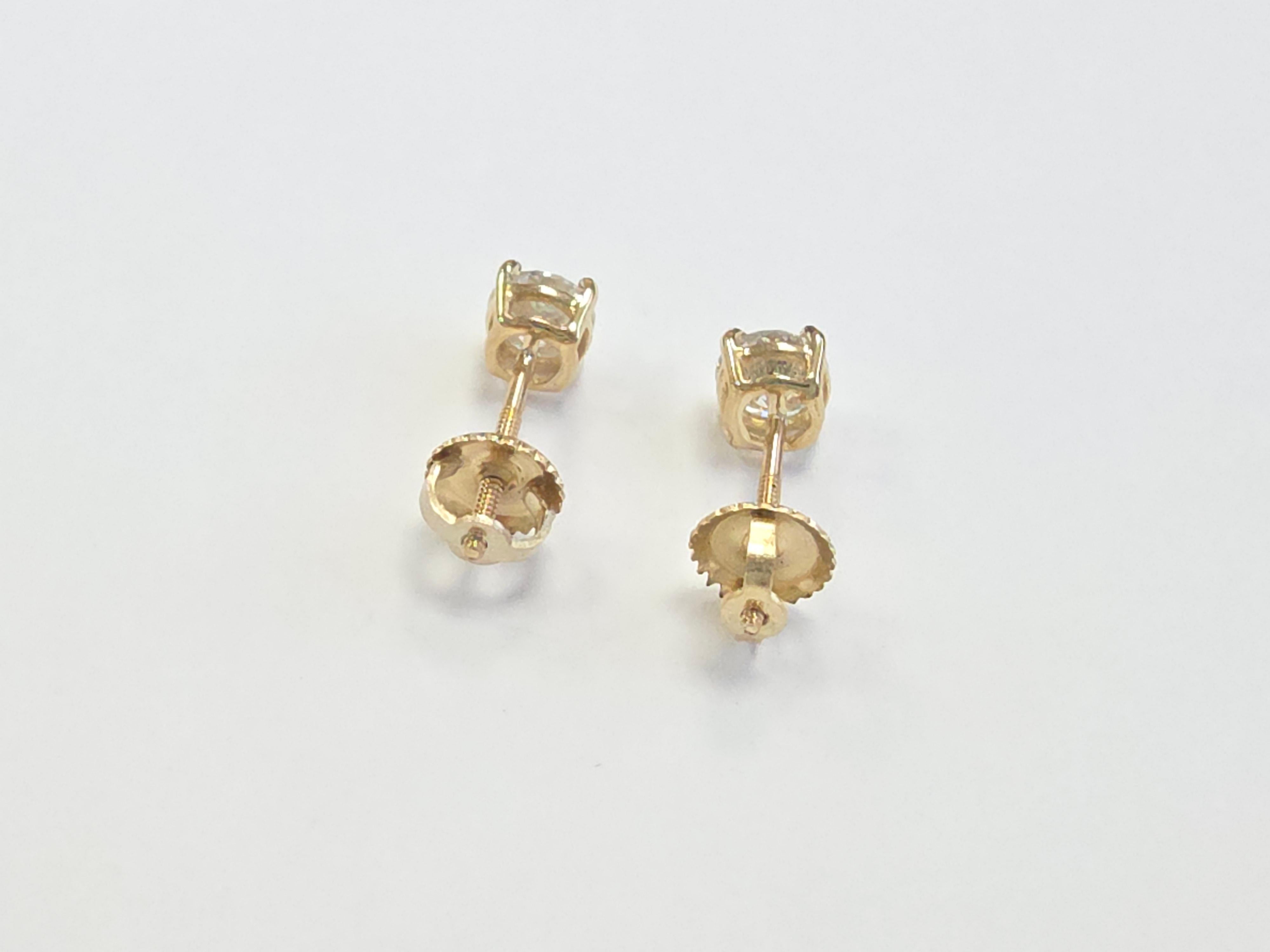 0.95 Carat Natural Round Brilliant Diamond Stud Earrings in 14K Yellow Gold

Elevate your jewelry collection with this timeless pair of natural diamond stud earrings featuring a total of 0.95 carats of round brilliant-cut diamonds, gracefully set in