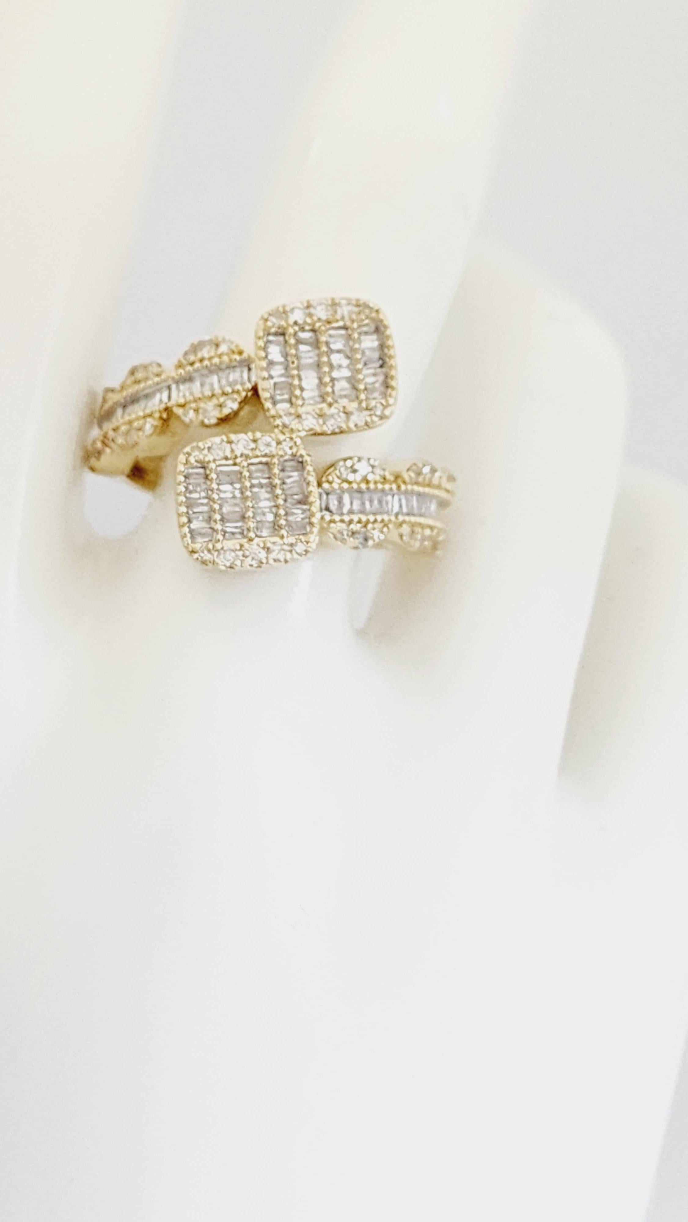 0.95 Carat Natural Diamond 14 Karat Yellow Gold Ring 
Very Shiny & Clean, Average Color I Clarity I. 
Natural baguettes and round diamonds, 
Ring Size 10