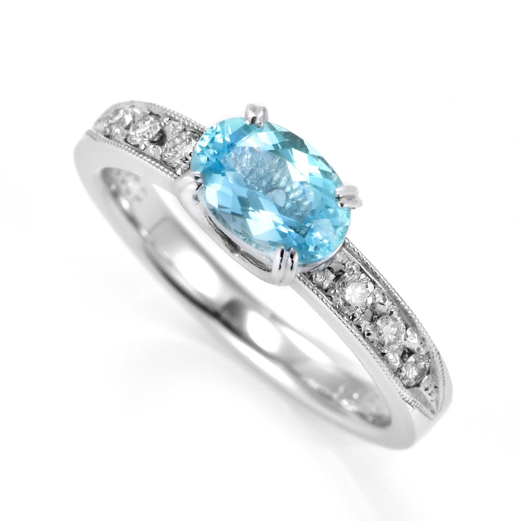 A beautiful ring featuring 0.956 Carats Natural, Neon Blue Mozambican Paraiba Tourmaline and 0.20 Carats of Diamond Accents made in Platinum. Paraiba Tourmalines were only discovered 30 years ago in the Brazilian state of the same name- Paraiba.