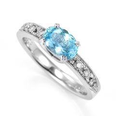 0.95 Carat Natural Paraiba Tourmaline and Diamond Ring Made in Platinum