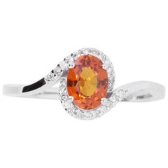 0.95 Carat Oval Orange Sapphire and 0.11 Carat White Diamond Ring
