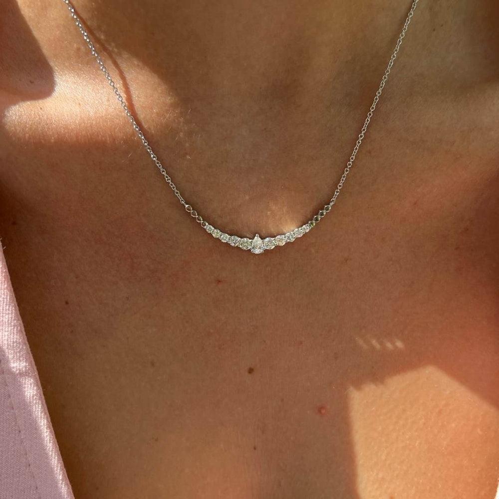 0.95 Carat Pear and Round Diamond Necklace in 14K White Gold, Shlomit Rogel

Captivating in design, this dainty necklace is a true beauty. Designed in 14k white gold, the Lor necklace features a special combination of round diamonds of different